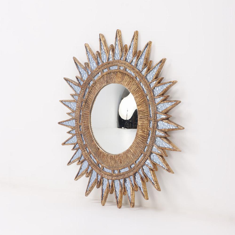 A blue textured glass and resin star form mirror in the manner of Line Vautrin. This mirror is hand made by an artist using vintage glass so it is one of a kind.