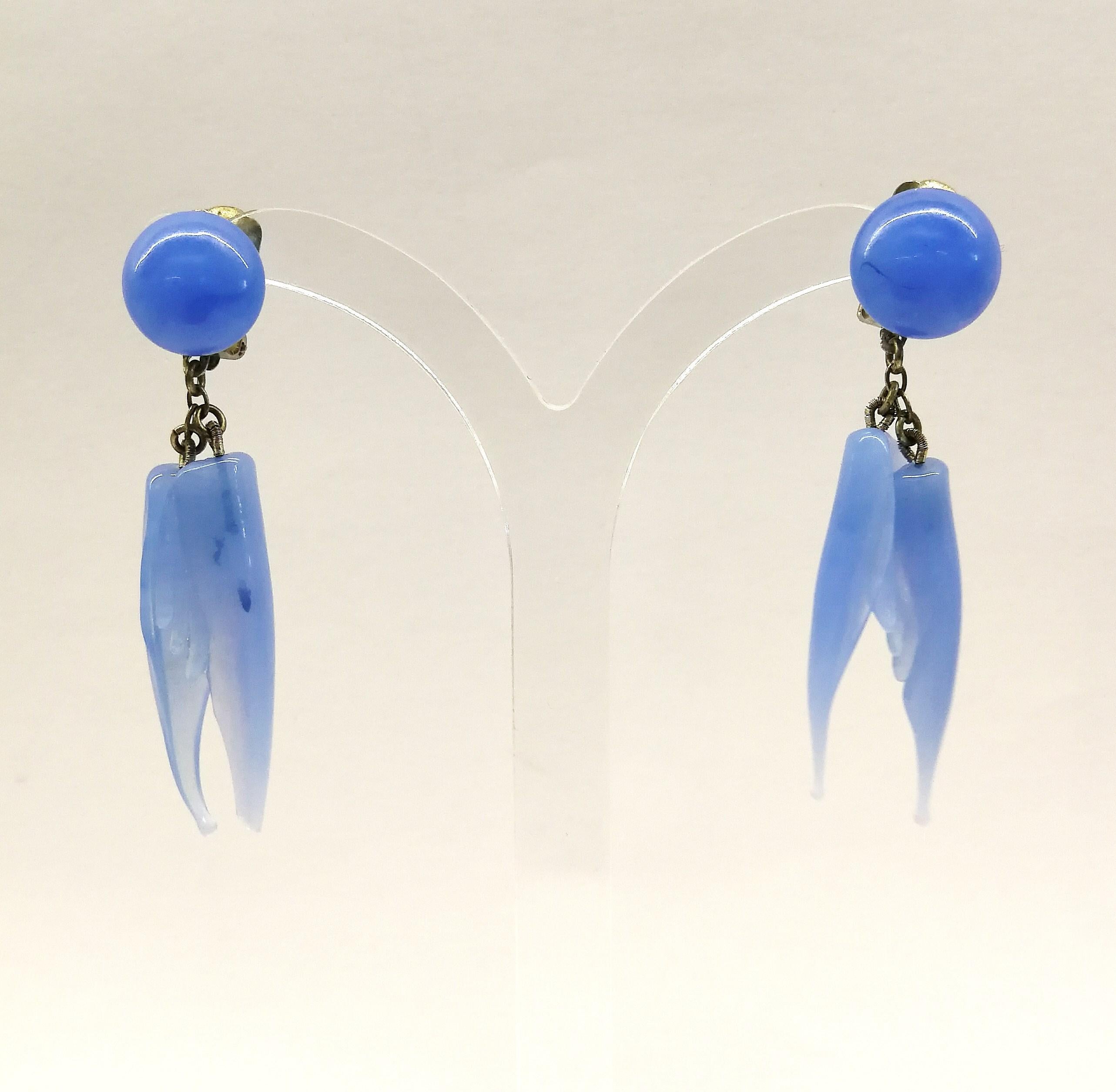 A bluebell blue moulded glass 'feather' motif' necklace and earrings, 1950s. 9