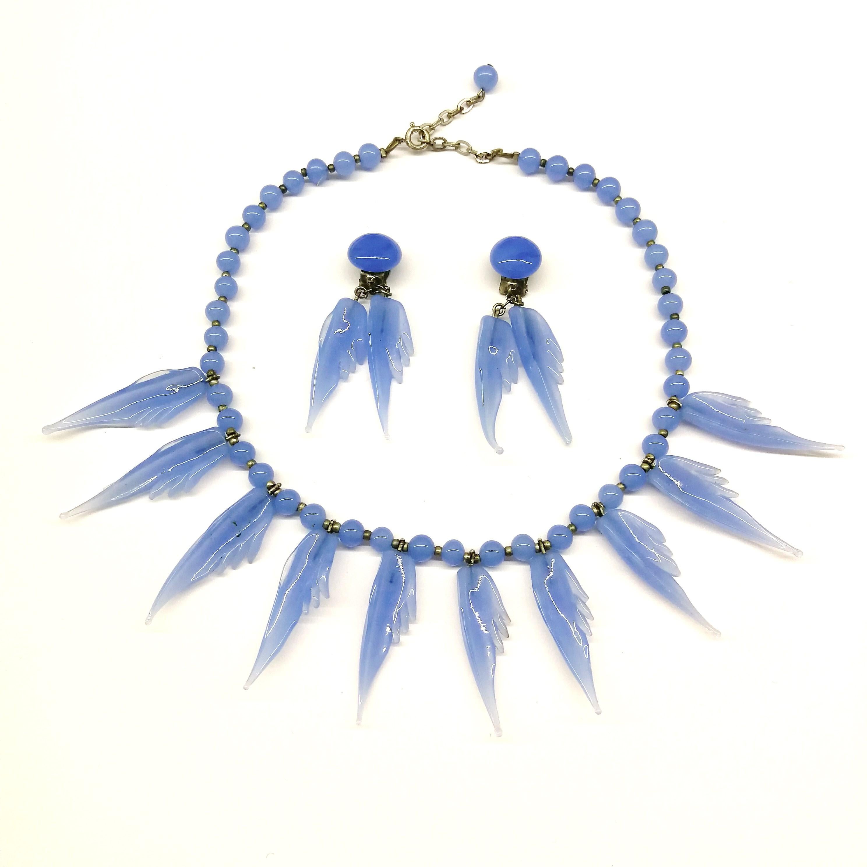 A bluebell blue moulded glass 'feather' motif' necklace and earrings, 1950s. In Good Condition In Greyabbey, County Down