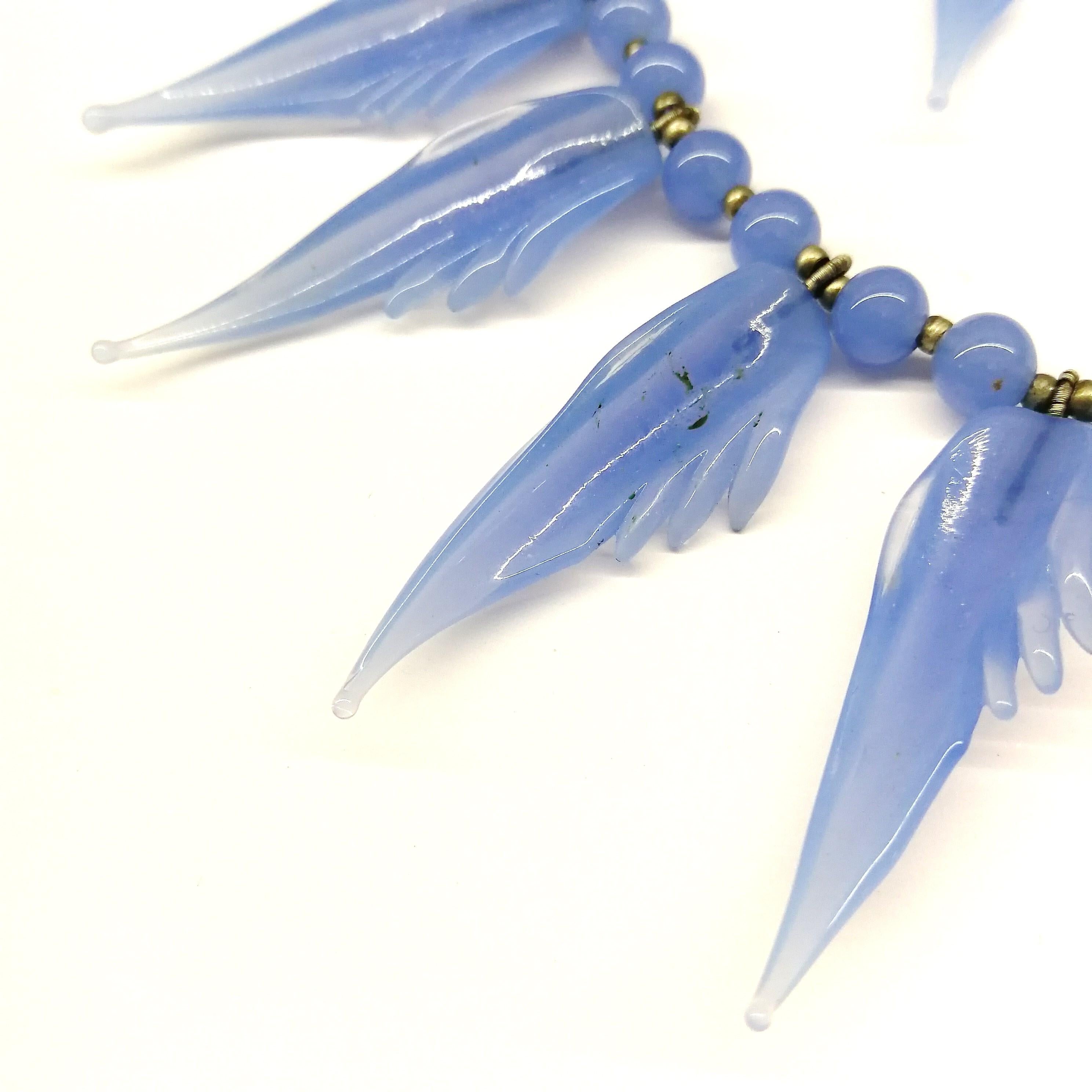 Women's A bluebell blue moulded glass 'feather' motif' necklace and earrings, 1950s.