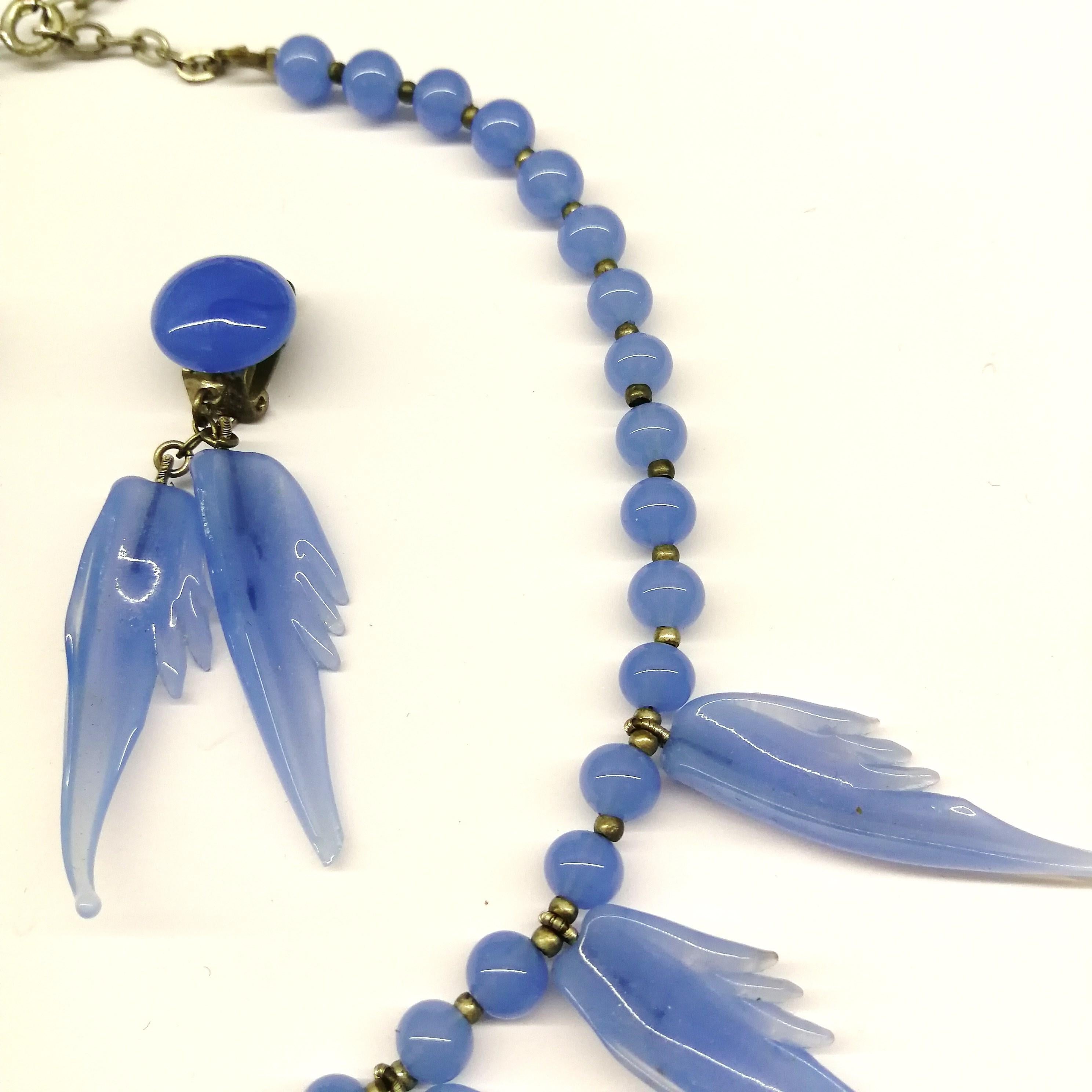 A bluebell blue moulded glass 'feather' motif' necklace and earrings, 1950s. 1