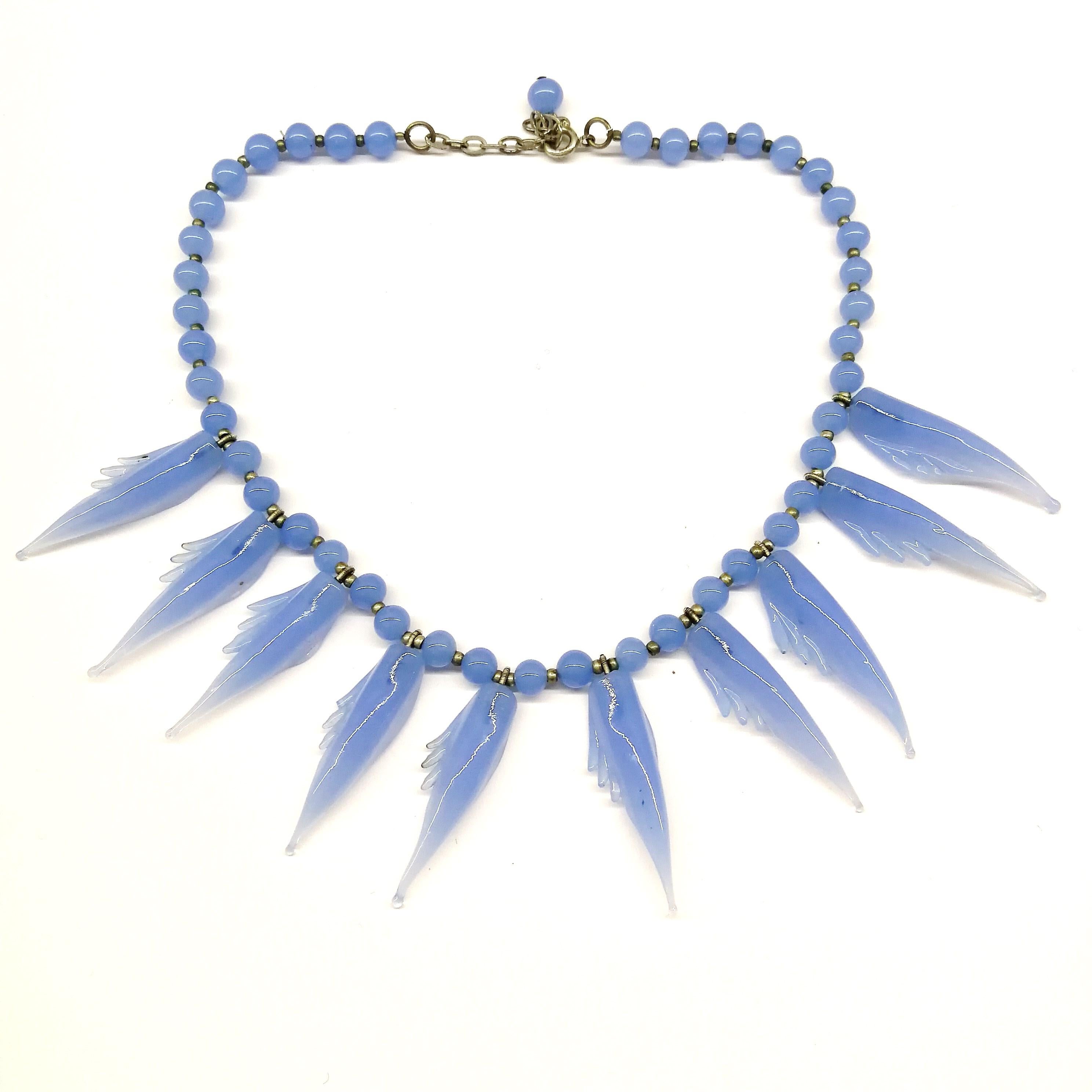 A bluebell blue moulded glass 'feather' motif' necklace and earrings, 1950s. 3