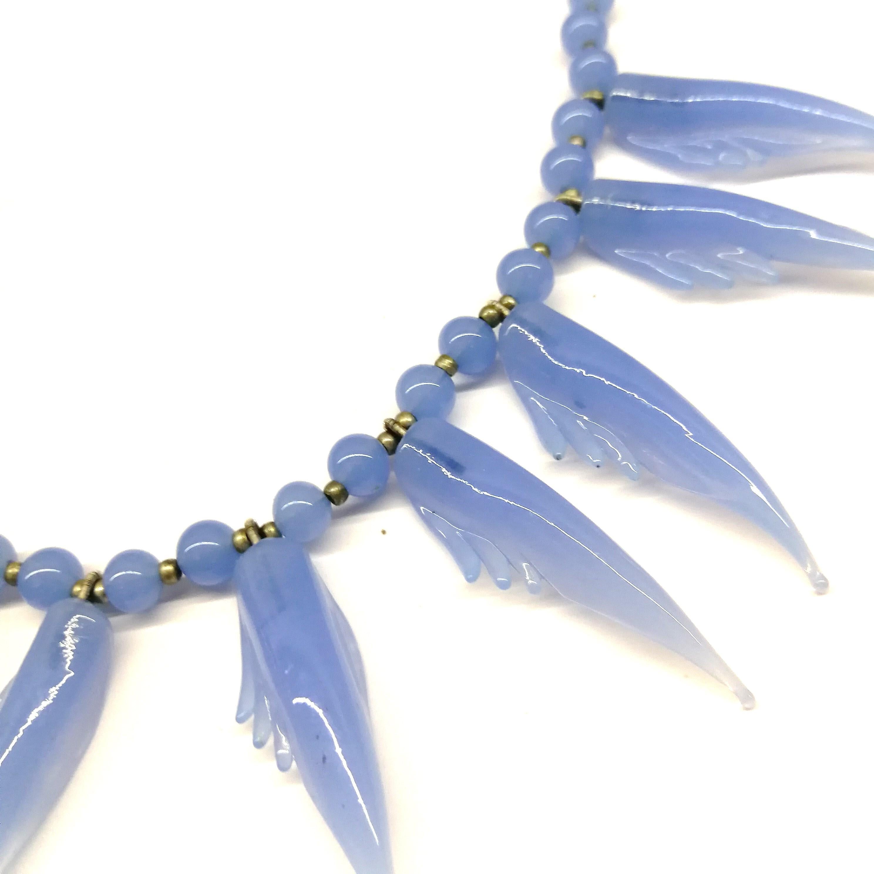 A bluebell blue moulded glass 'feather' motif' necklace and earrings, 1950s. 5