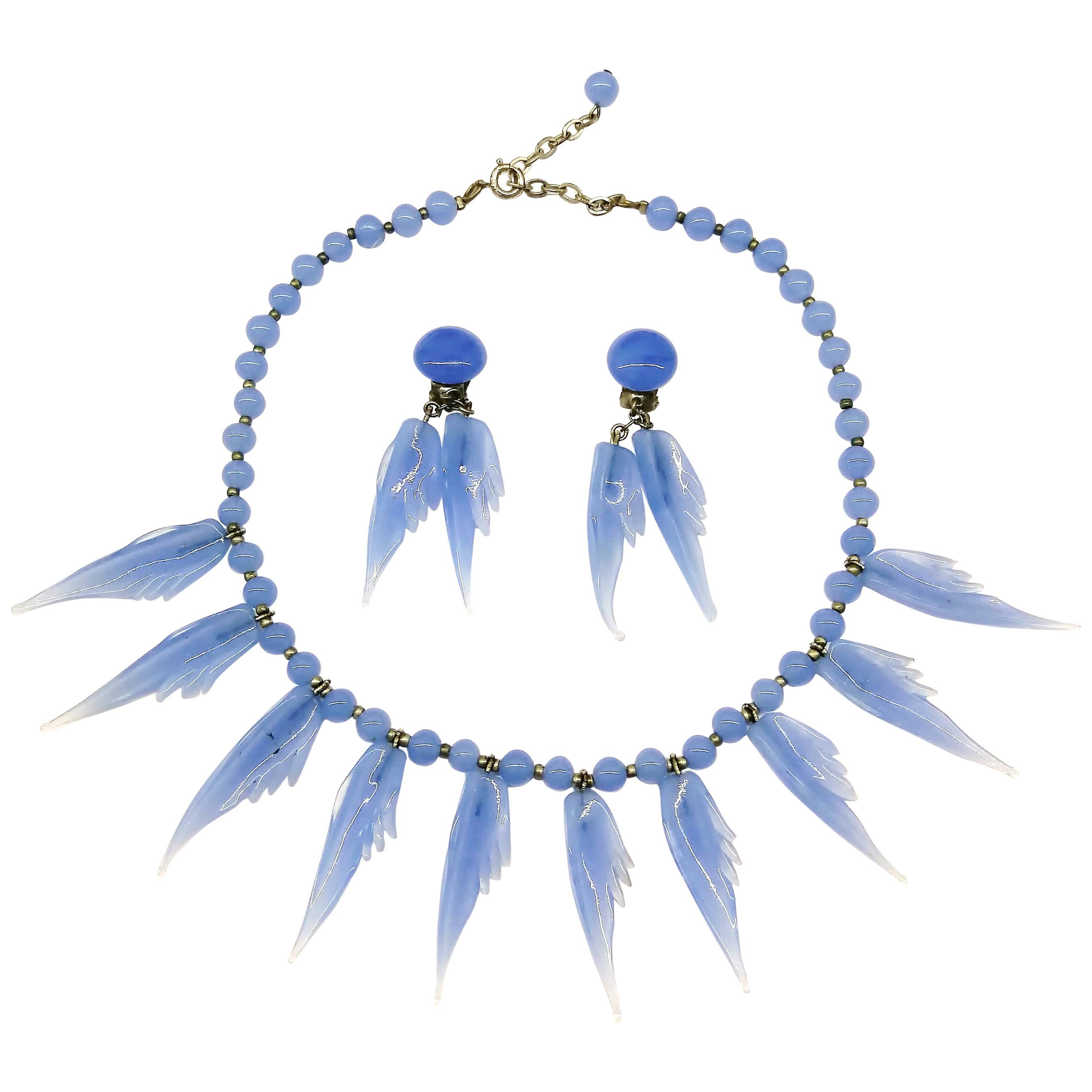 A bluebell blue moulded glass 'feather' motif' necklace and earrings, 1950s.