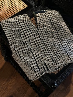 A Bobo ceremonial top decorated with cowrie shells