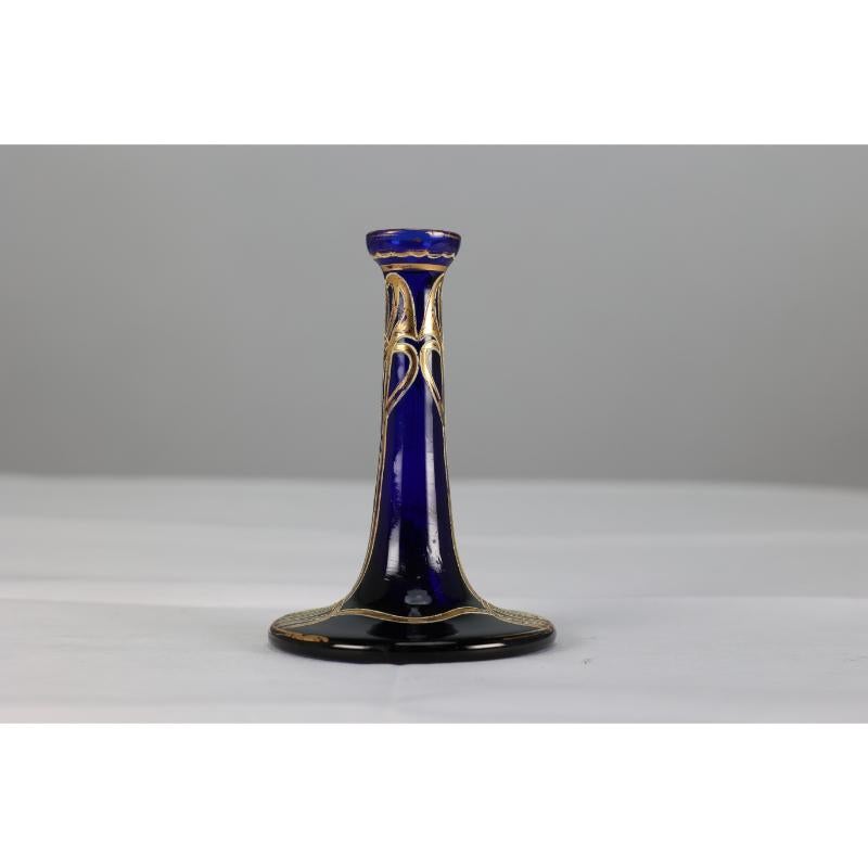 A Bohemian Austrian Art Nouveau gilded glass single flower vase in Bristol blue color with gilded floral overlay painting.
