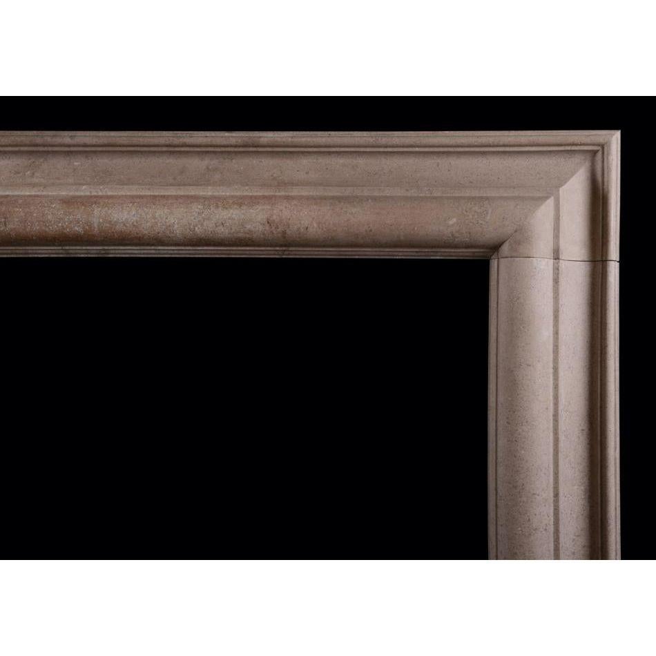 A bolection fireplace in a light Derbyshire Fossil stone. The moulded jambs and frieze in the Queen Anne style. English, circa 1900. 

Additional information:
Shelf Width: 1320 mm / 52