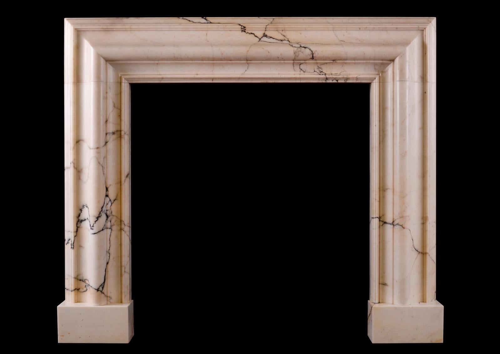 English A Bolection Fireplace in Povanazzo Marble For Sale