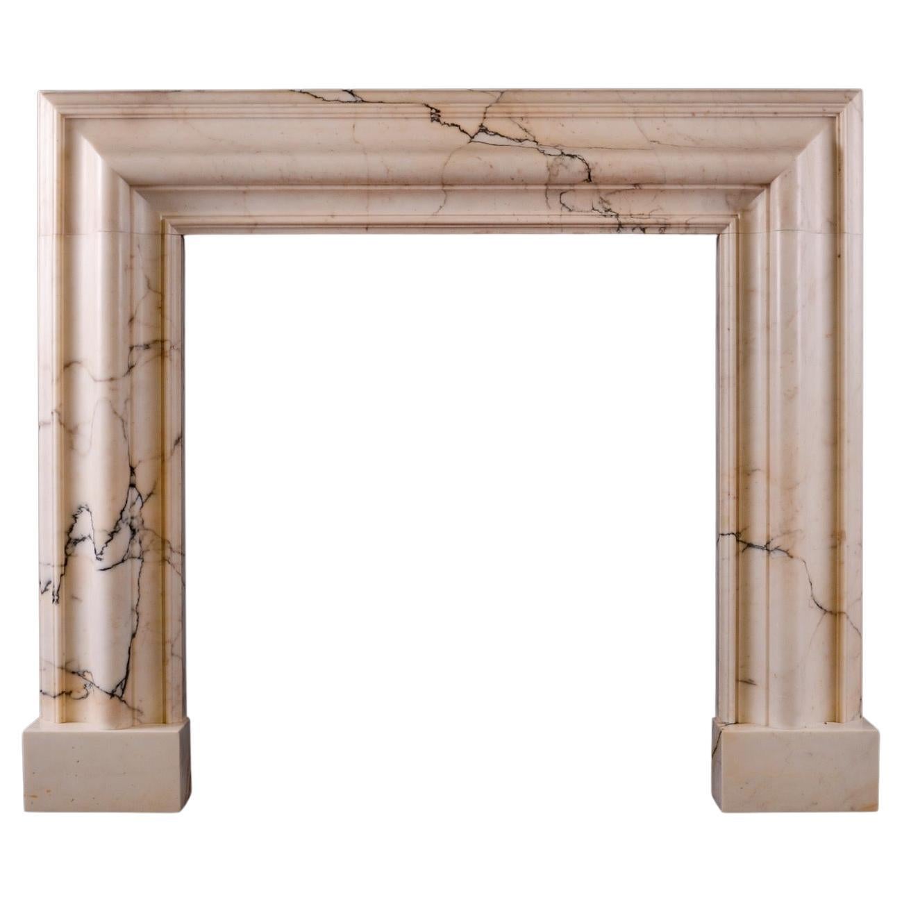 A Bolection Fireplace in Povanazzo Marble For Sale