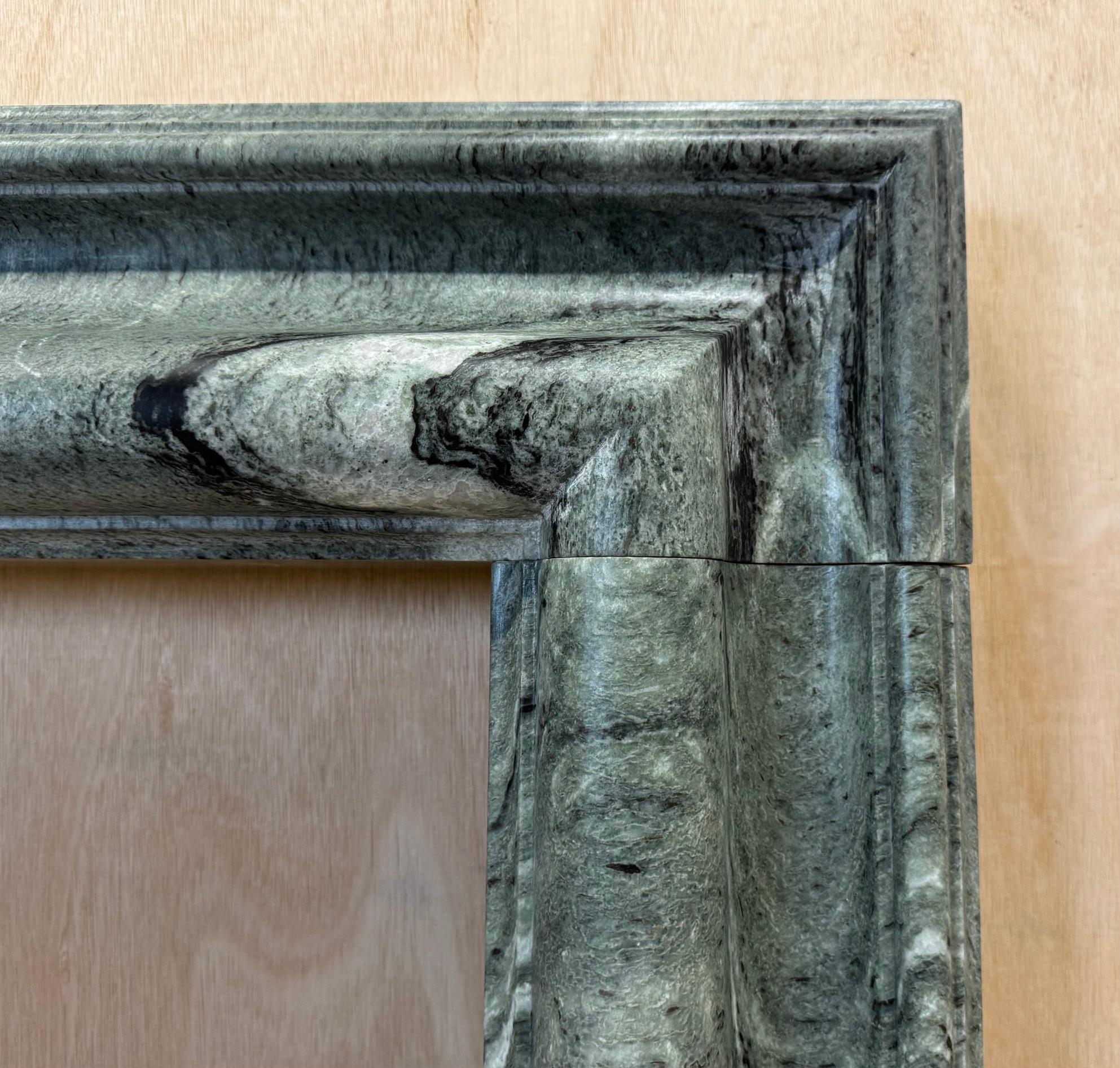 Hand-Crafted A bolection style Connemara Marble Mantel, Fireplace by Ryan & Smith For Sale