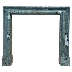 A bolection style Connemara Marble Mantel, Fireplace by Ryan & Smith