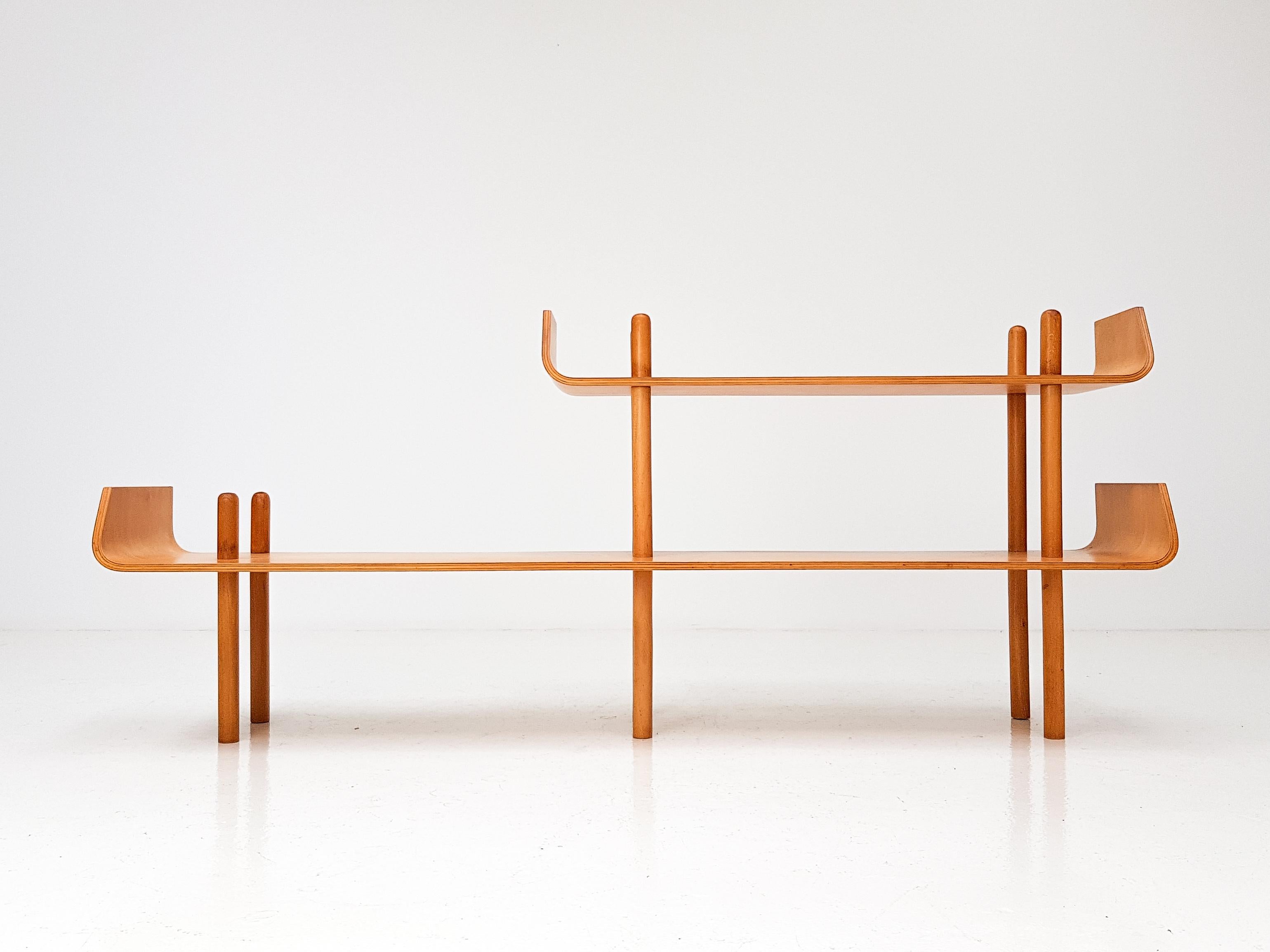 A birch plywood shelving unit by Willem Lutjens for De Boer Gouda, with the characteristic curved ends of the shelves which has made this such a famous and now rare design. The piece was designed in 1953 and manufactured in the Netherlands.

The
