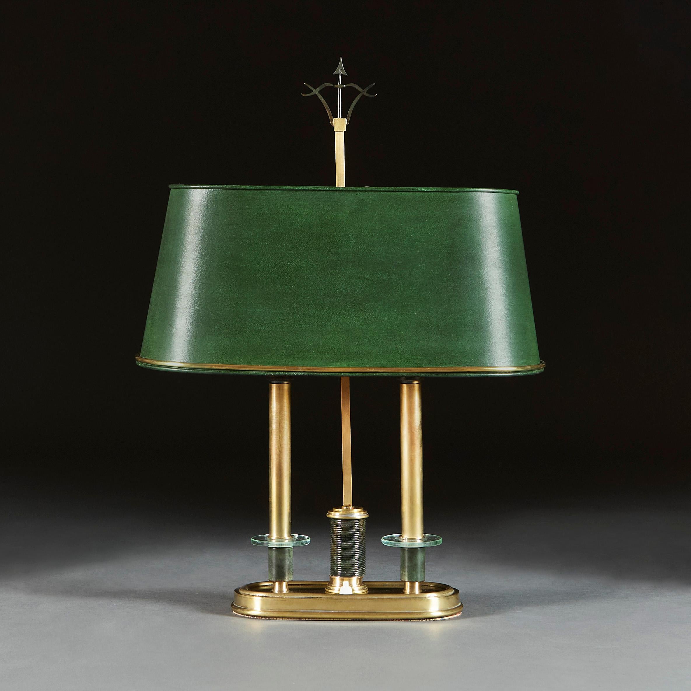 Italy, circa 1950

An unusual midcentury bouillotte lamp of oval form with green tole shade, with oval brass base supporting two brass candles, each with bronze sconces with glass discs.

Total height 62.00cm
Width 44.00cm
Depth 16.00cm.

Please