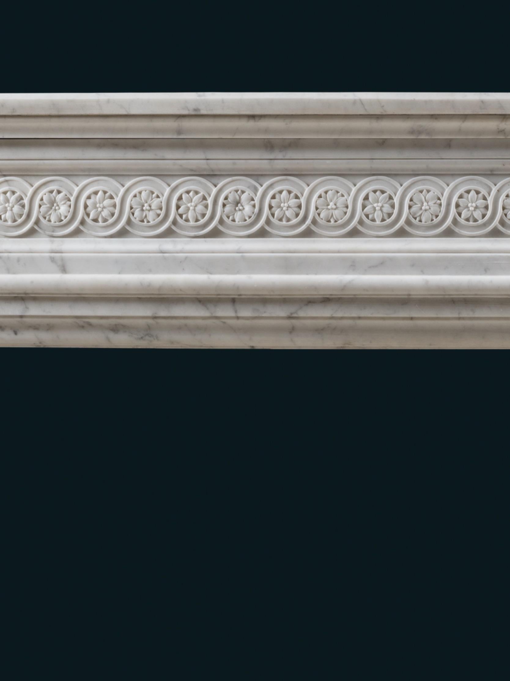 Hand-Carved A Bowed 19th Century Louis XVI Style Chimneypiece For Sale