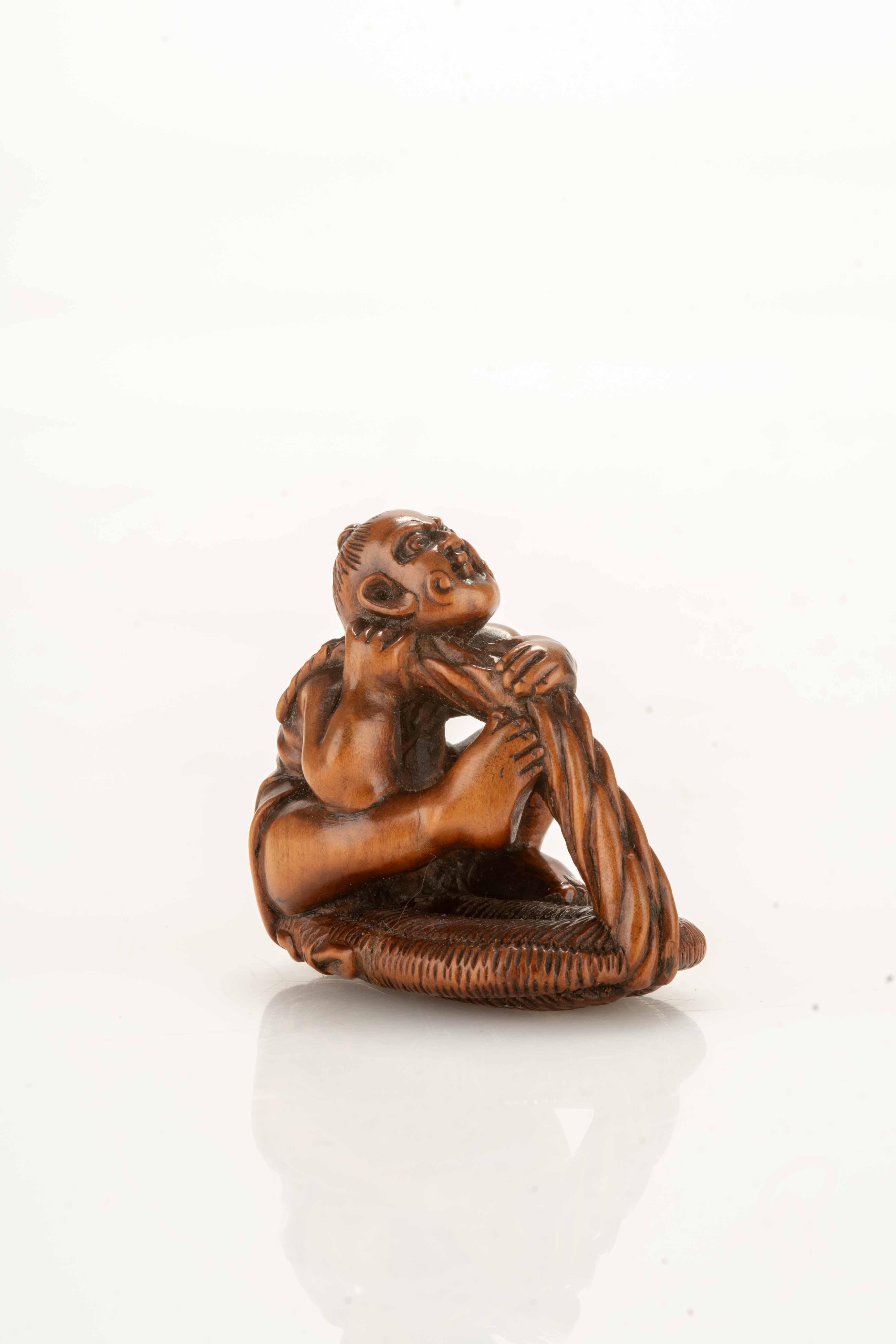 Japanese A Boxwood Netsuke Depicting A Nio With A Giant Sandal