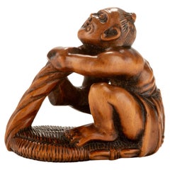 A Boxwood Netsuke Depicting A Nio With A Giant Sandal