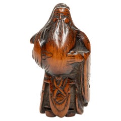 A boxwood netsuke depicting the Chinese general Guan Yu