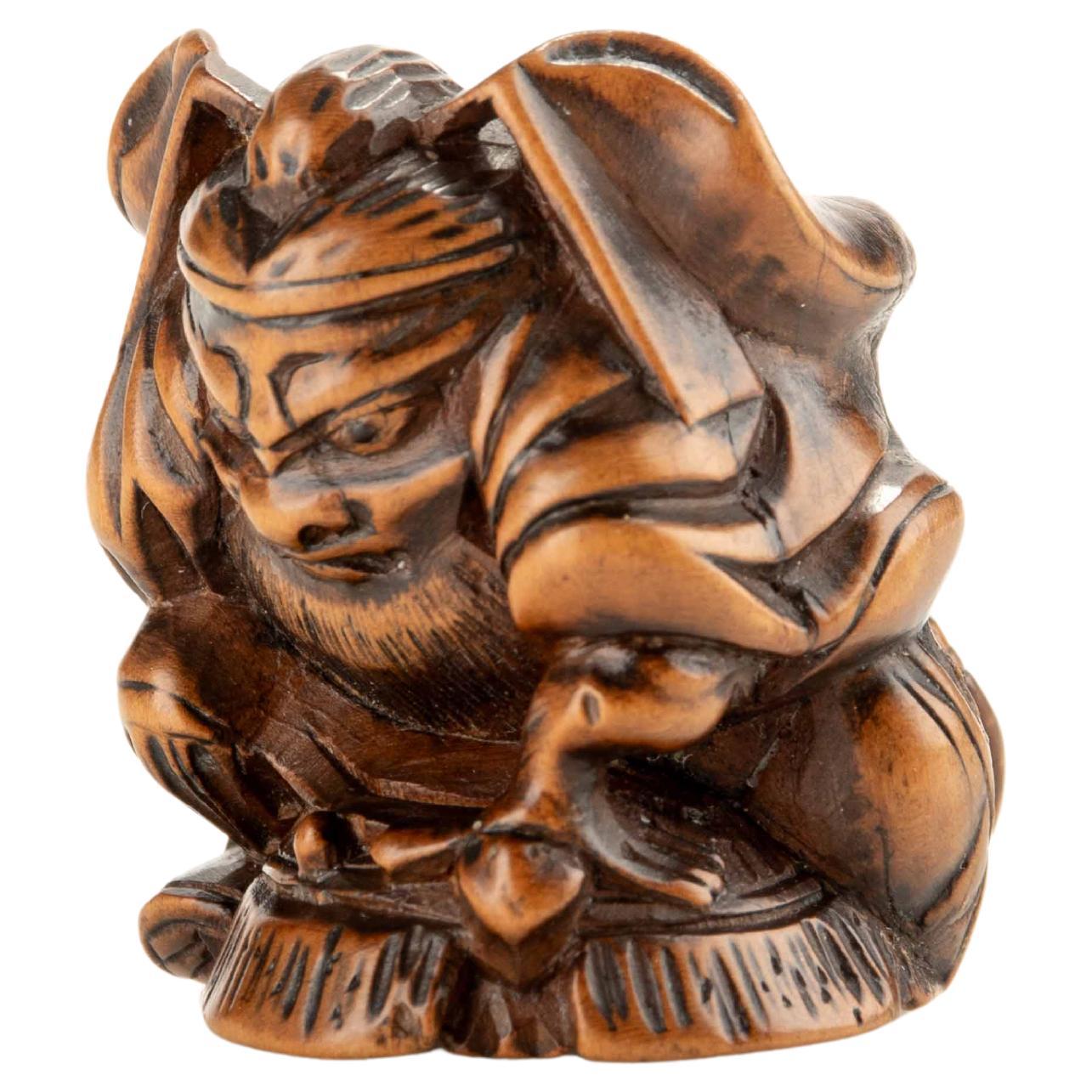 Netsuke en buis de Shoki avec un Oni en vente