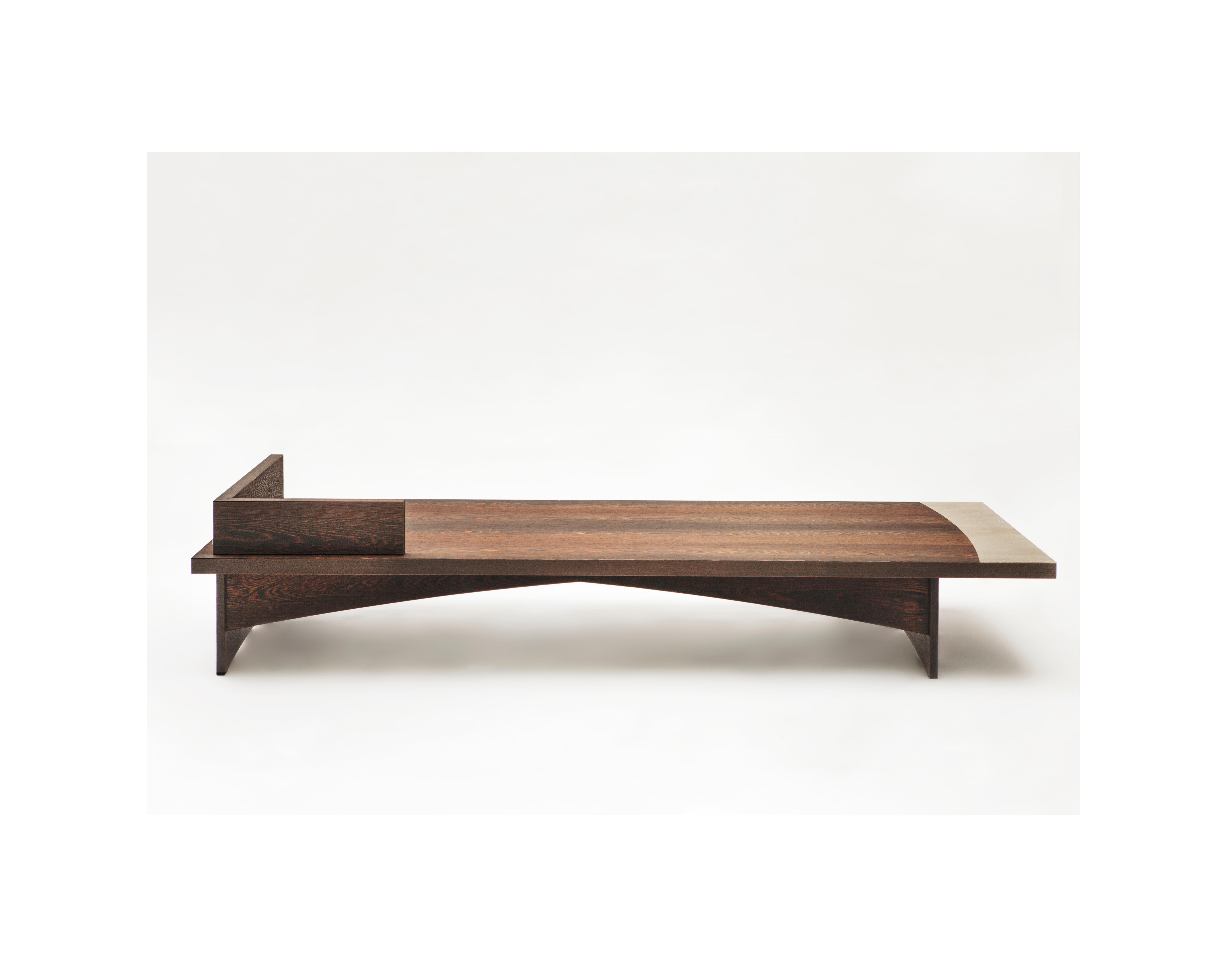 A Branda (typical Italian term describing a simple essential bed) is a simple and sophisticated piece of furniture, unique thanks to its details, geometrical shapes, and acquired wenge wooden profiles with an insert in cement. 
The beauty of the