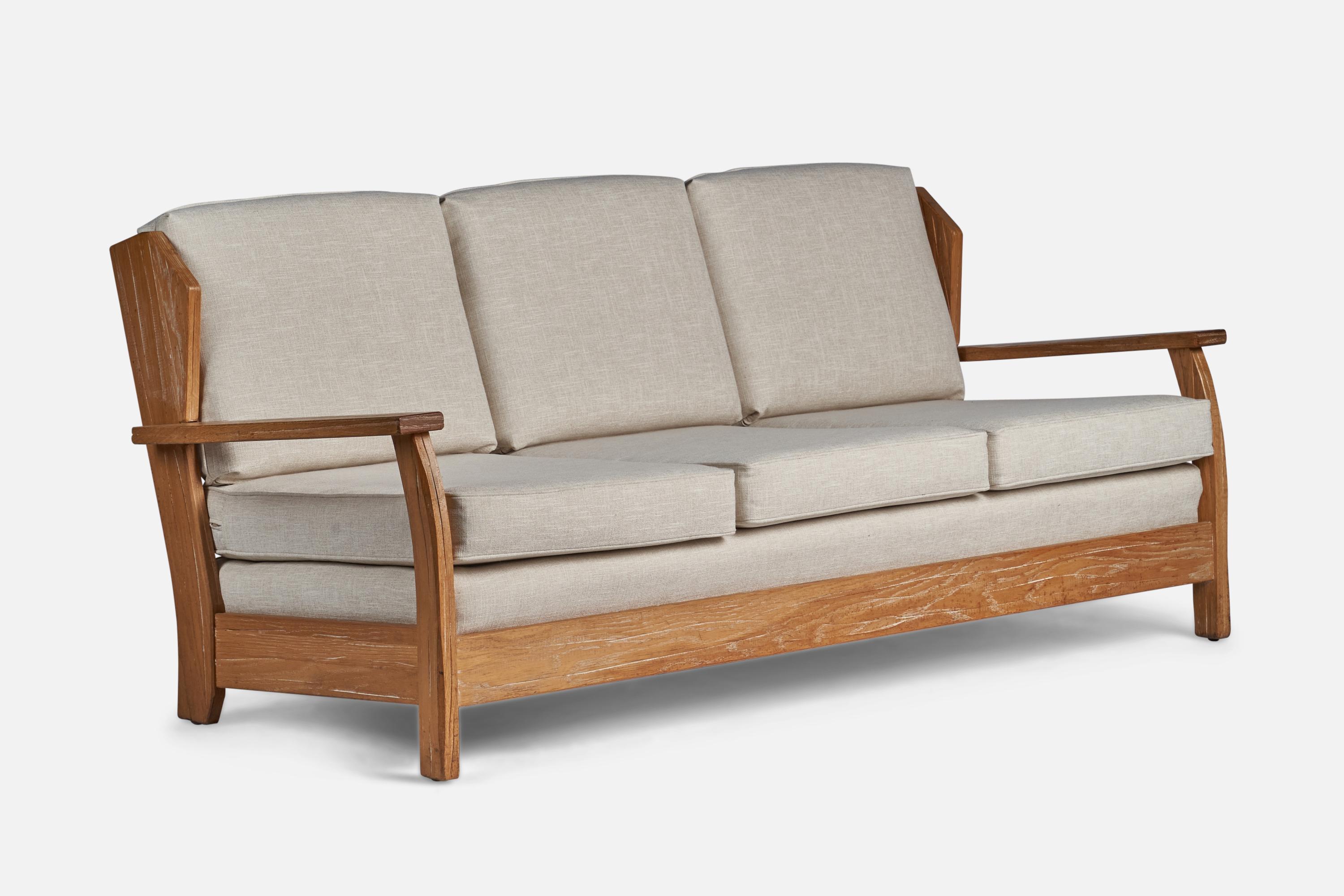 A cerused oak and off-white fabric sofa designed and produced by A. Brandt Ranch Oak, USA, c. 1950s.
16.5” seat height