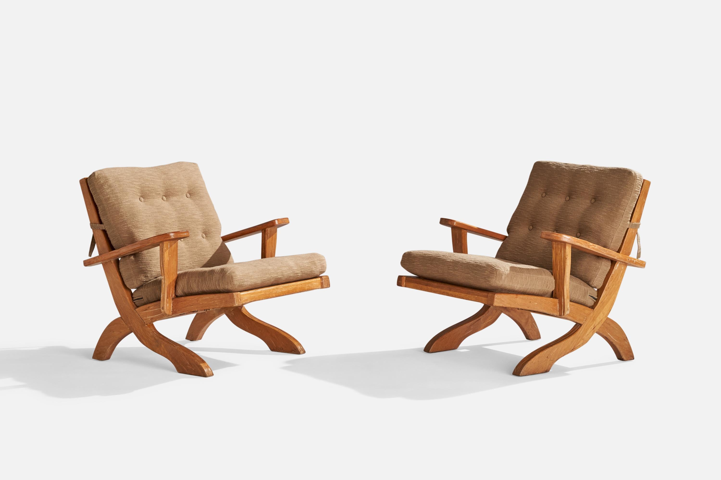 A pair of oak and brown fabric lounge chair designed and produced by A. Brandt Ranch Oak, USA, 1950s.

Seat height 17”.
