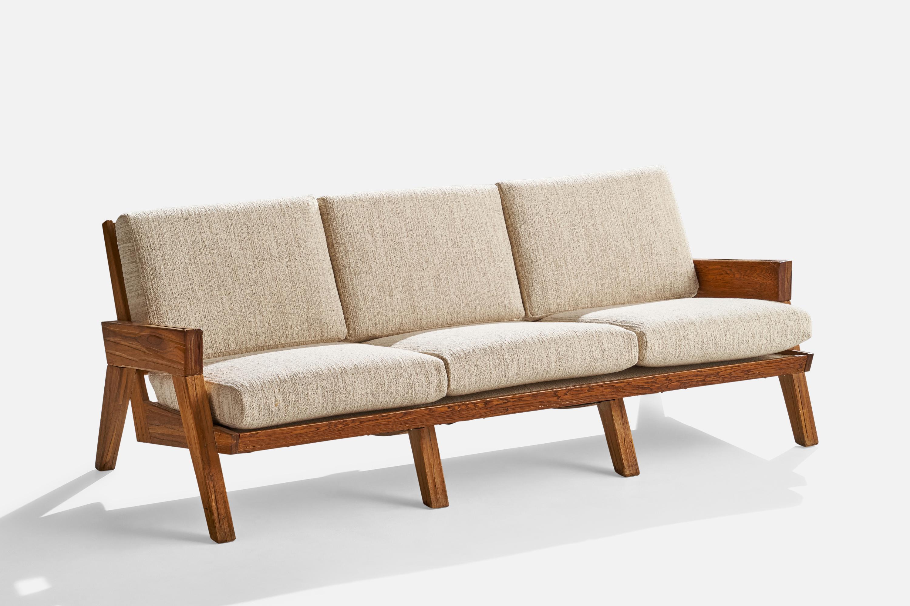 A cerused oak and off-white fabric sofa designed and produced by A. Brandt Ranch Oak, USA, c. 1950s.

Seat height 16”