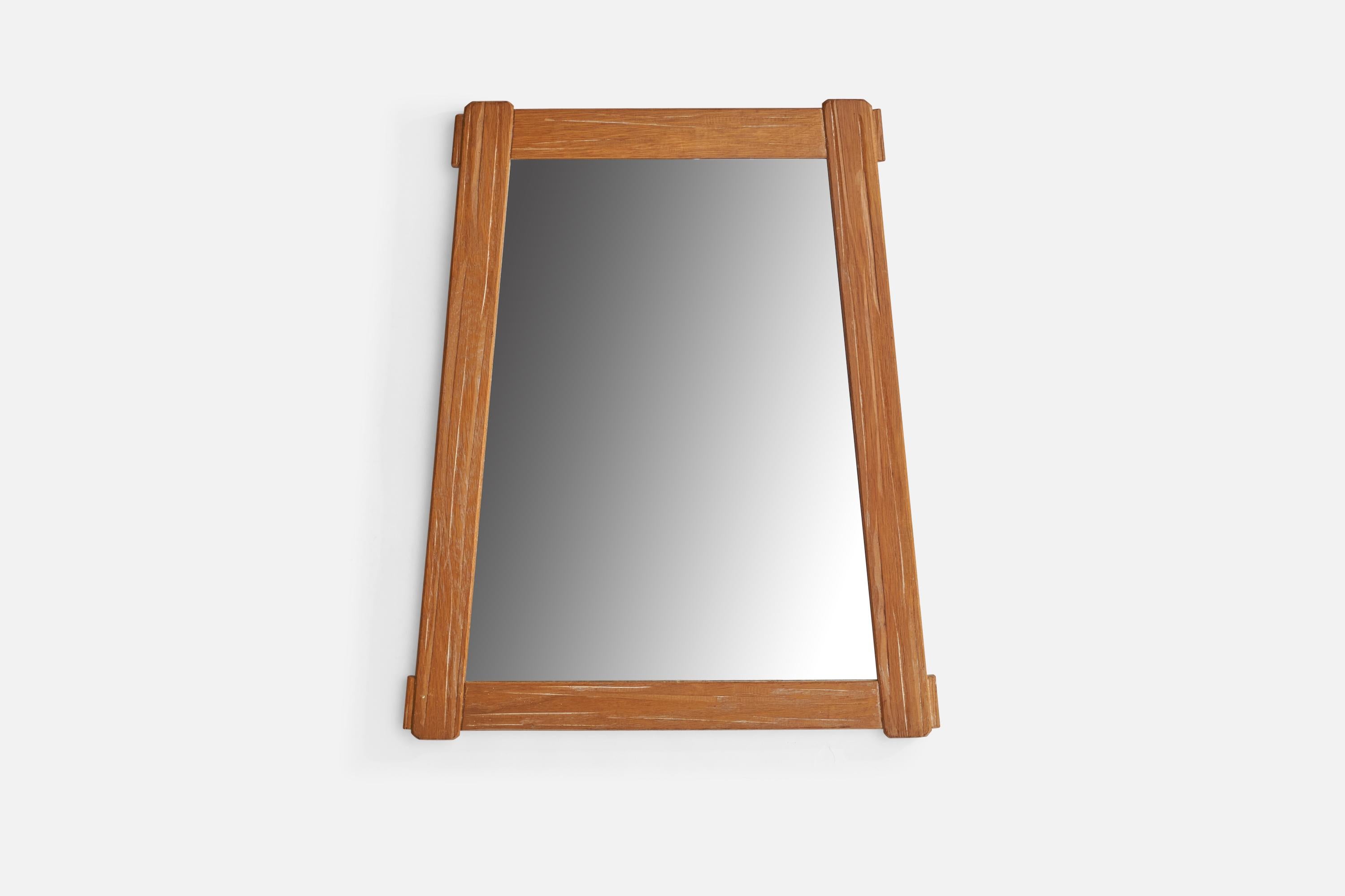 A carved oak wall mirror designed and produced by A. Brandt Ranch Oak, USA, 1958.