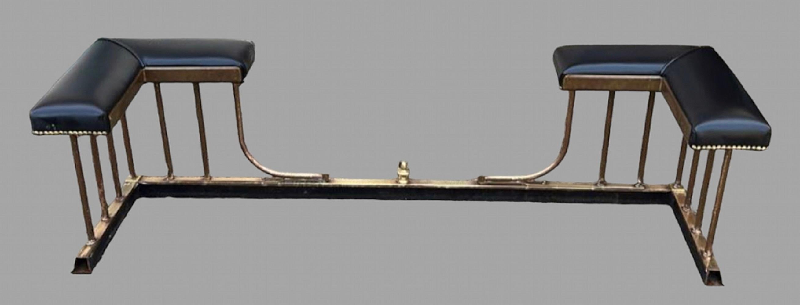 An Attractive c 1970's brass and black leather club fender. The internal measurements are Depth 36 cm and Width 148 cm with a seat width of 18 cm