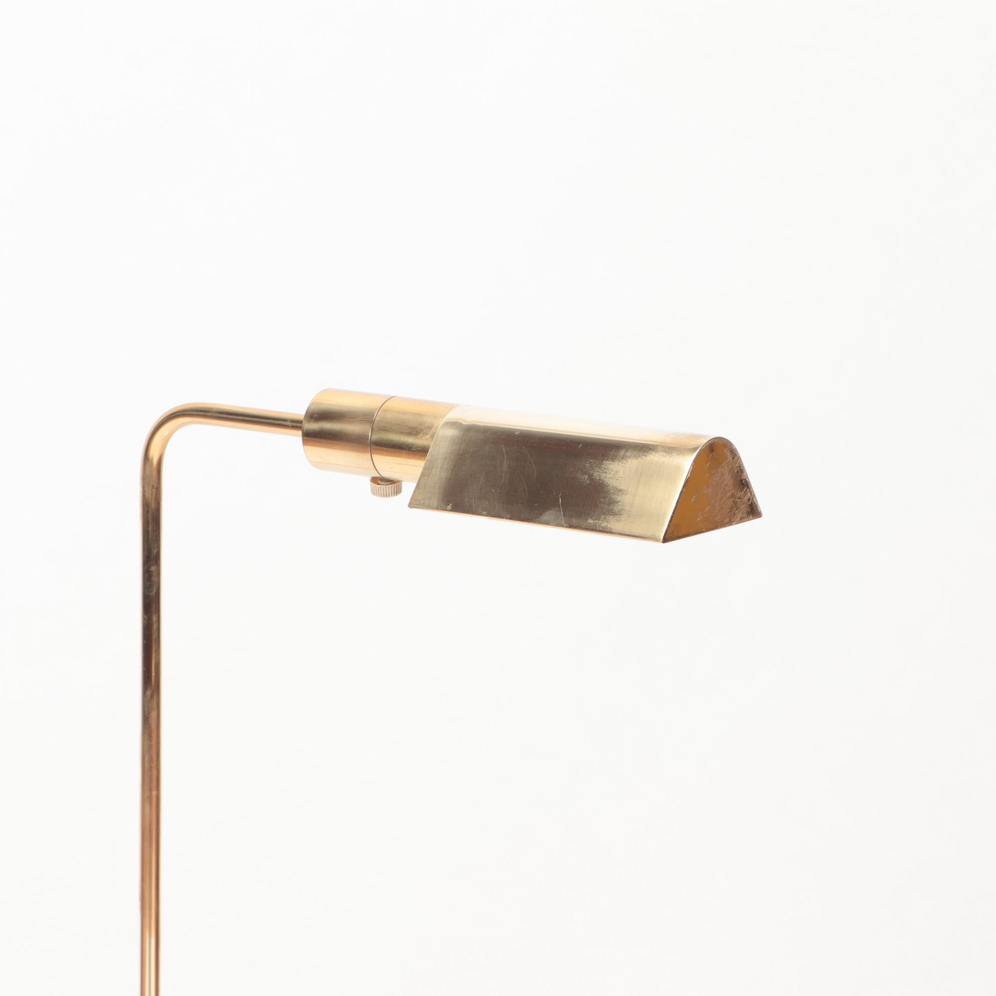 An unusual Brass and glass adjustable floor lamp. C 1970.