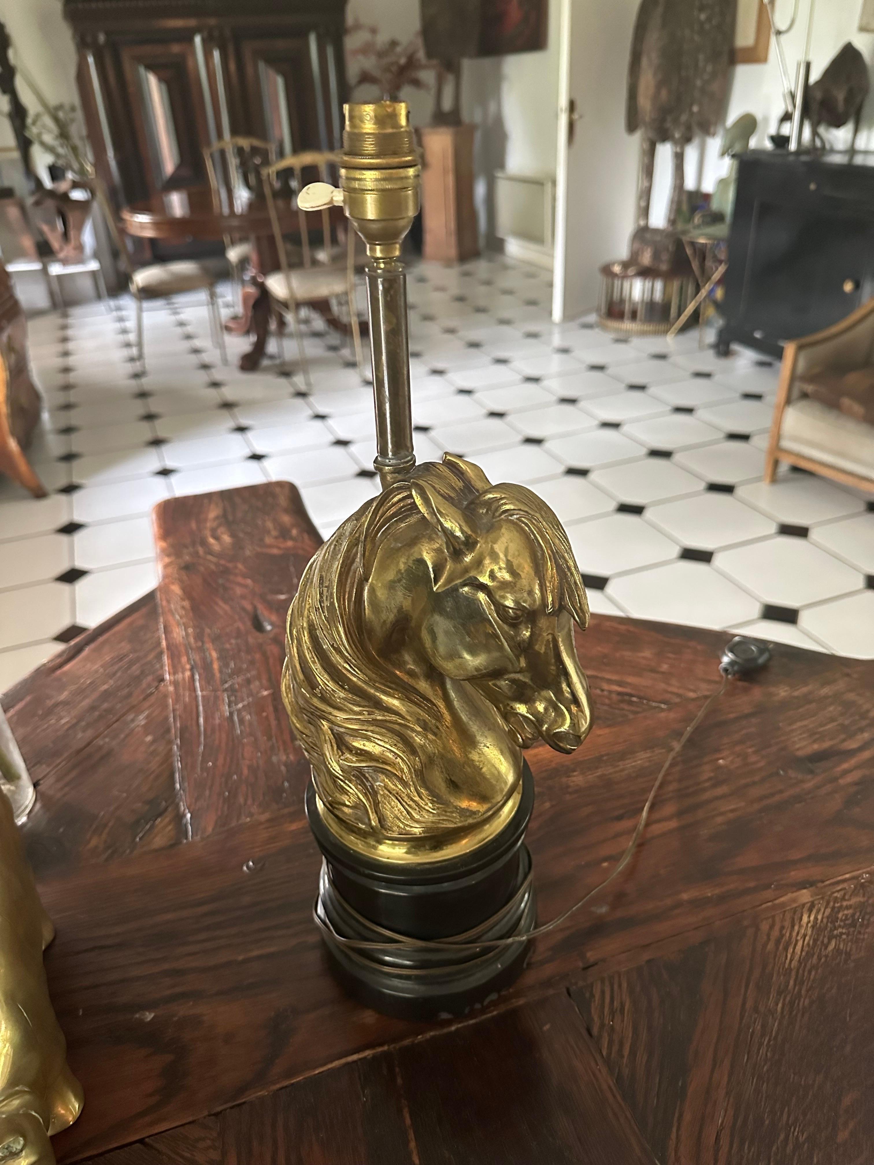 an unique horse brass head table lamp attributed to Maison Jansen