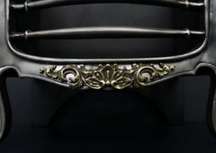 A Brass and Polished Steel French Firegrate