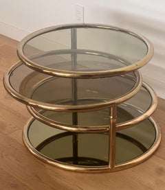 A brass and smoked glass “rings” coffee table, attr. Baughman, circa 1970