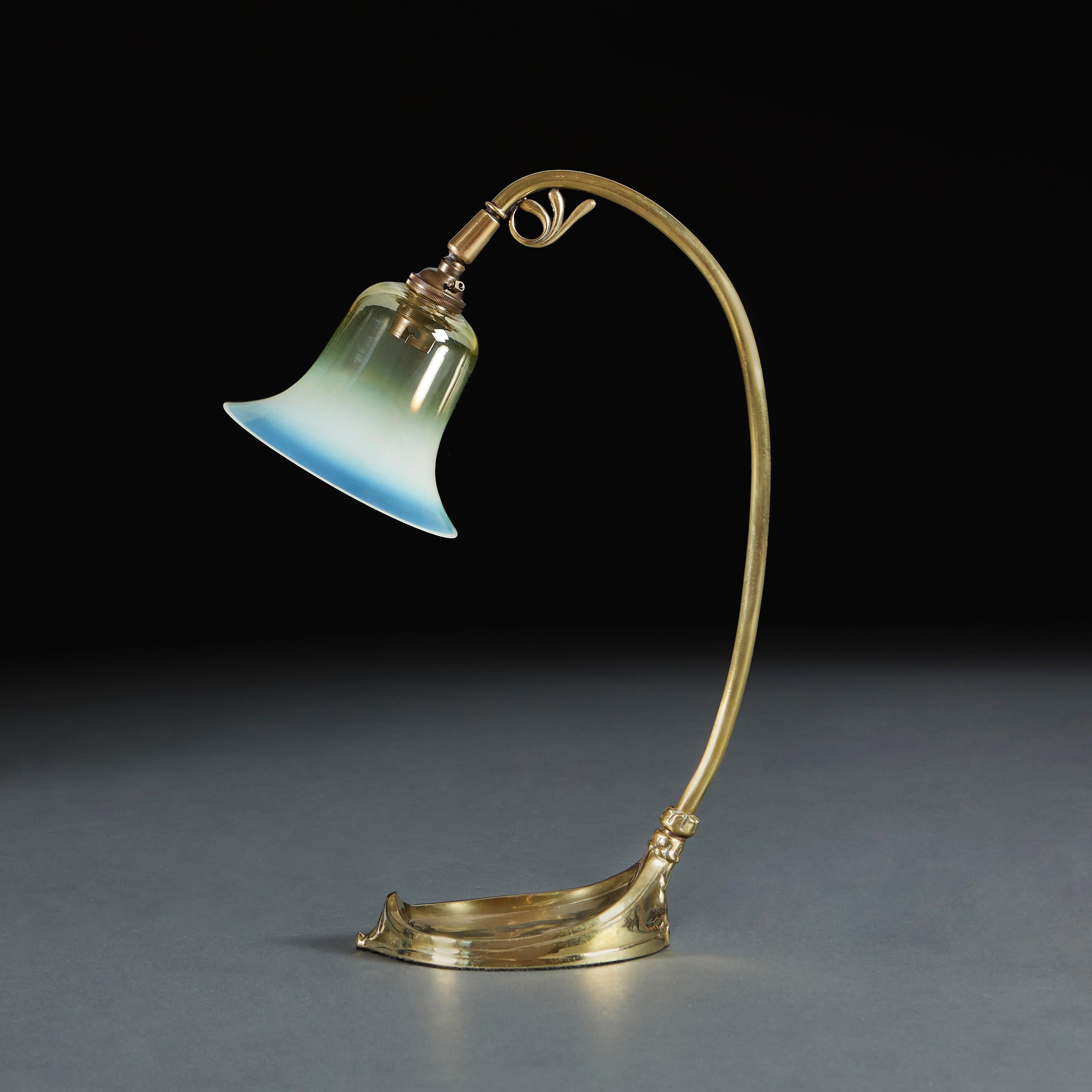 England, circa 1890

A fine pair of blue glaze vases with swirling decorative handles to the necks, with bulbous bodies and flared rims, now as lamps. Made for Liberty & Co.

Height of vase 37.00cm
Height with shade 62.00cm
Diameter of base