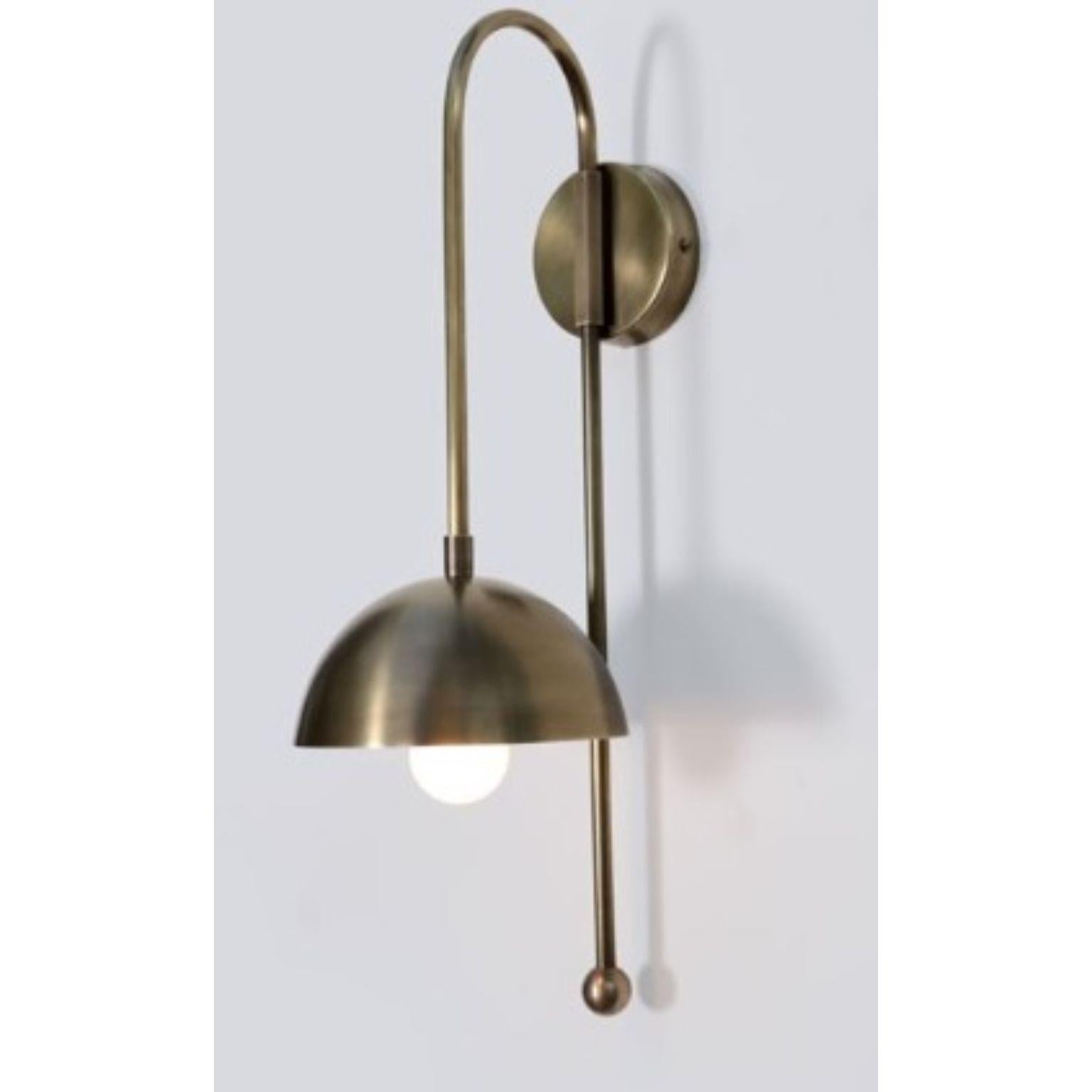 A Brass Dome Wall Sconce by Lamp Shaper
Dimensions: D 15.5 x W 22 x H 48.5 cm.
Materials: Brass.

Different finishes available: raw brass, aged brass, burnt brass and brushed brass Please contact us.

All our lamps can be wired according to each