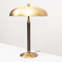 Lámpara de mesa Einar Bäckström de latón con asa de polipiel