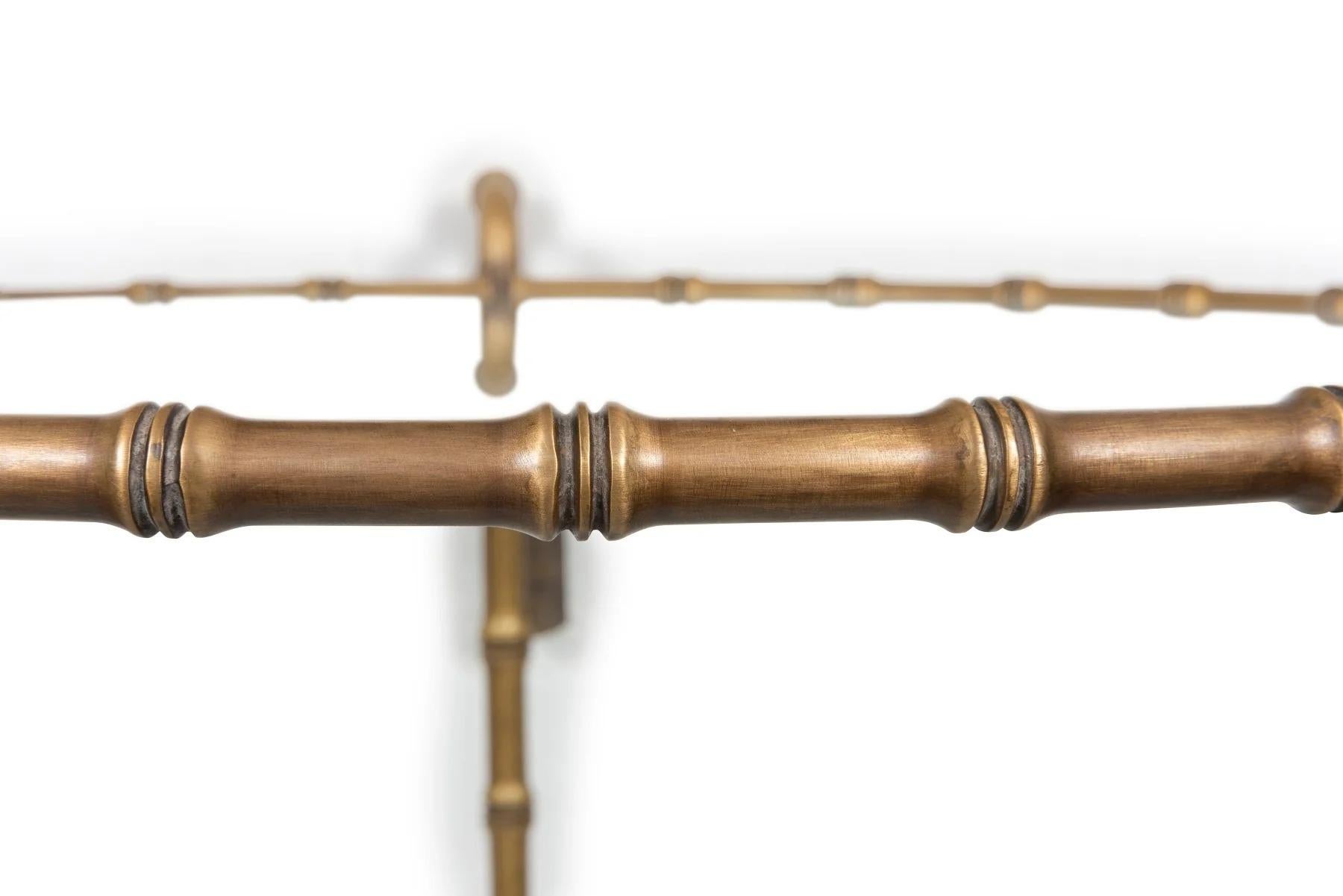 A Brass Gueridon with Faux Bamboo Detail

Faux bamboo gueridon with two glass tiers and three ring handles.

Provenance: Private Australian Collection.

Dimensions:
Height: 65cm
Diameter: 54cm