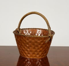 A Brass Loop-Handled Dimpled Basket