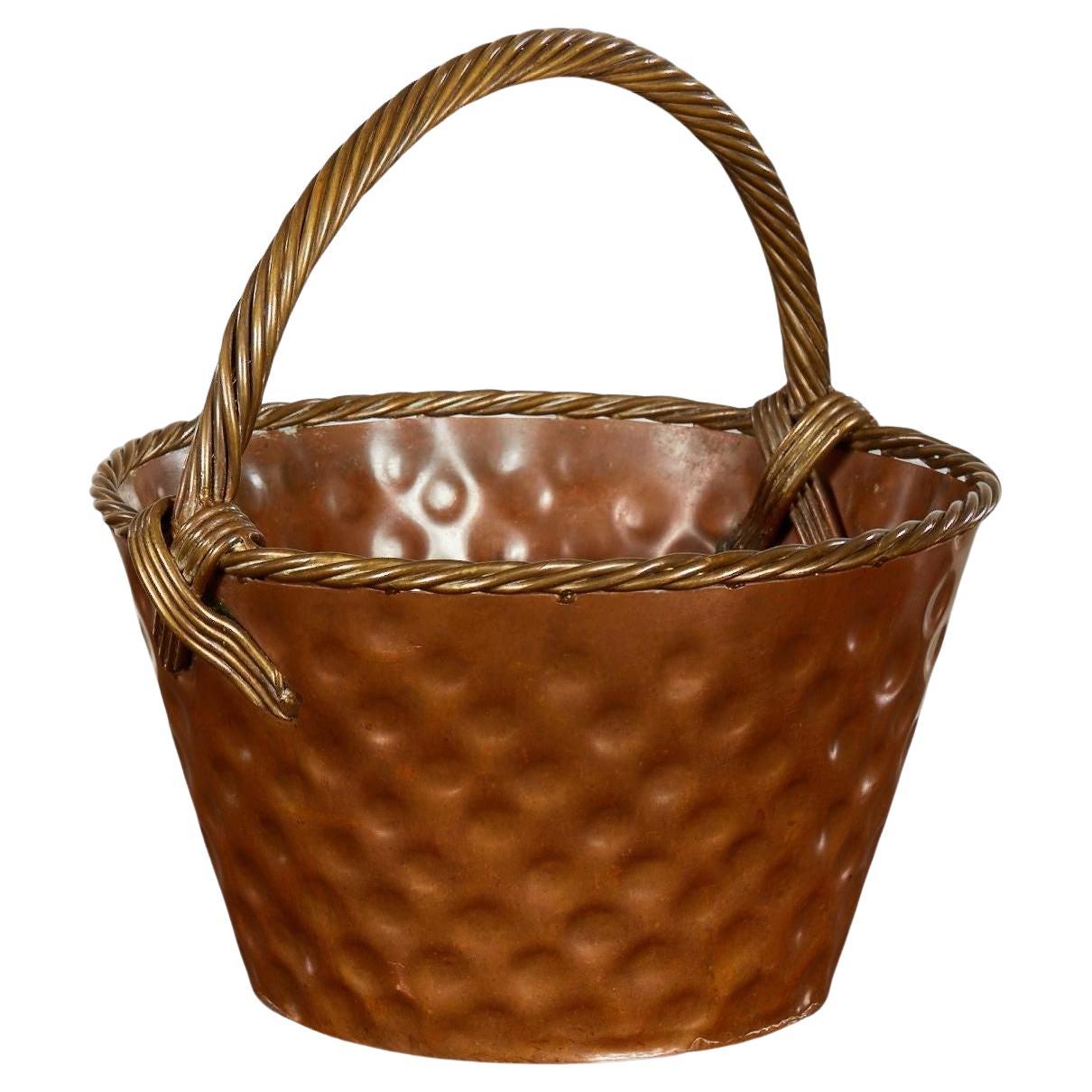 A Brass Loop-Handled Dimpled Basket