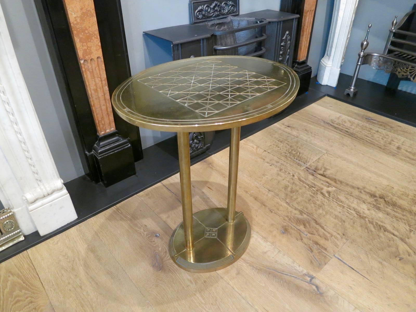 An unusual and rare side table by Hungarian designer Peter Ghyczy. The oval top with engraved chess table design. Stamped with designers mark.