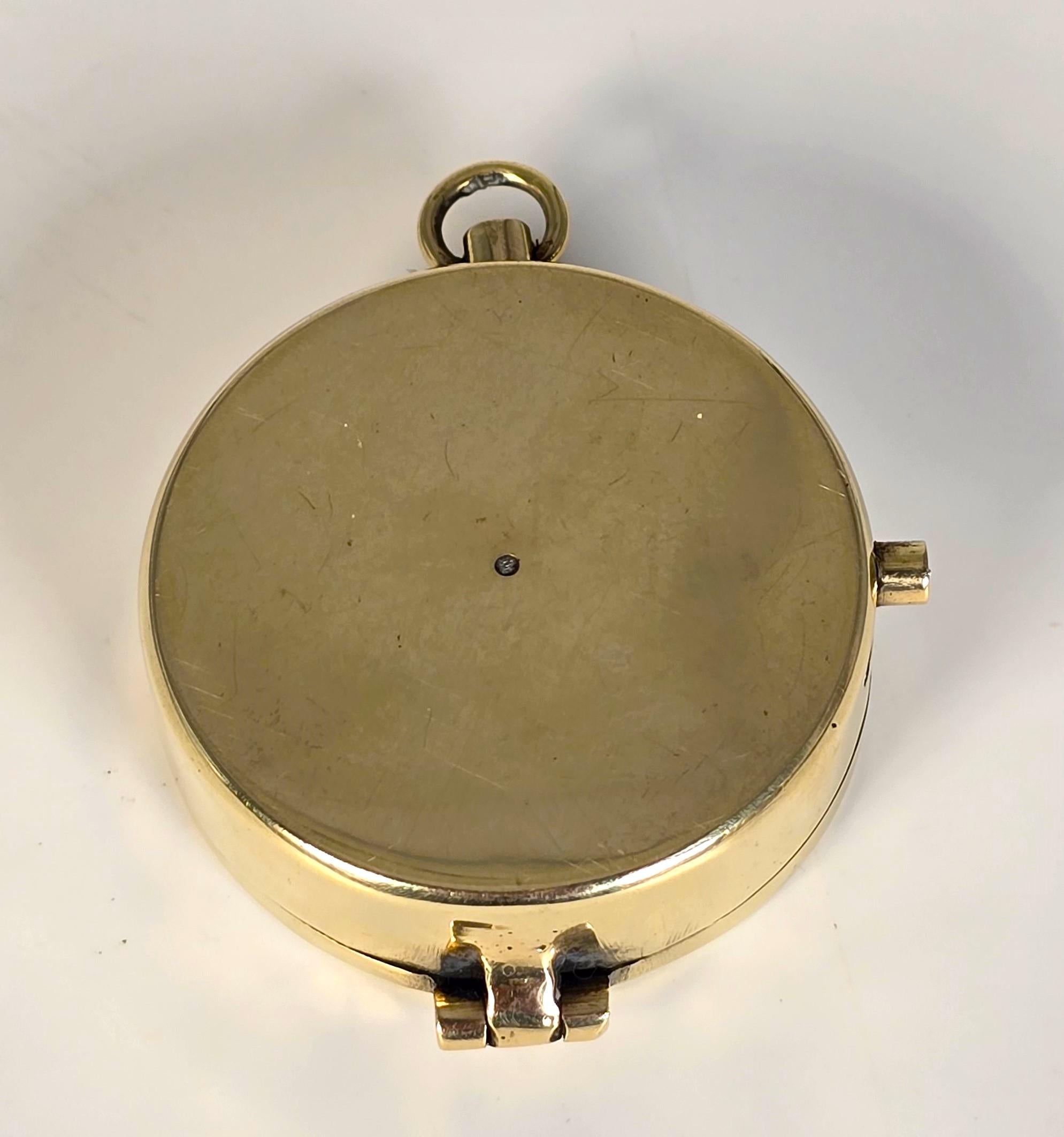 Brass A brass pocket compass by Barker and Sons of London, English circa 1890