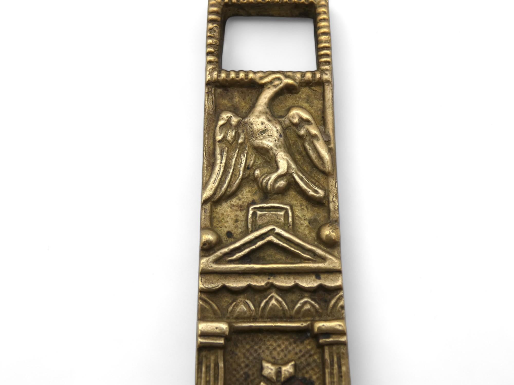 A Brass Polish Mezuzah Case from Poland circa 1900 represents a significant cultural artifact within the Jewish tradition. 

Mezuzah cases are small containers affixed to doorposts in Jewish homes, containing parchment scrolls inscribed with verses