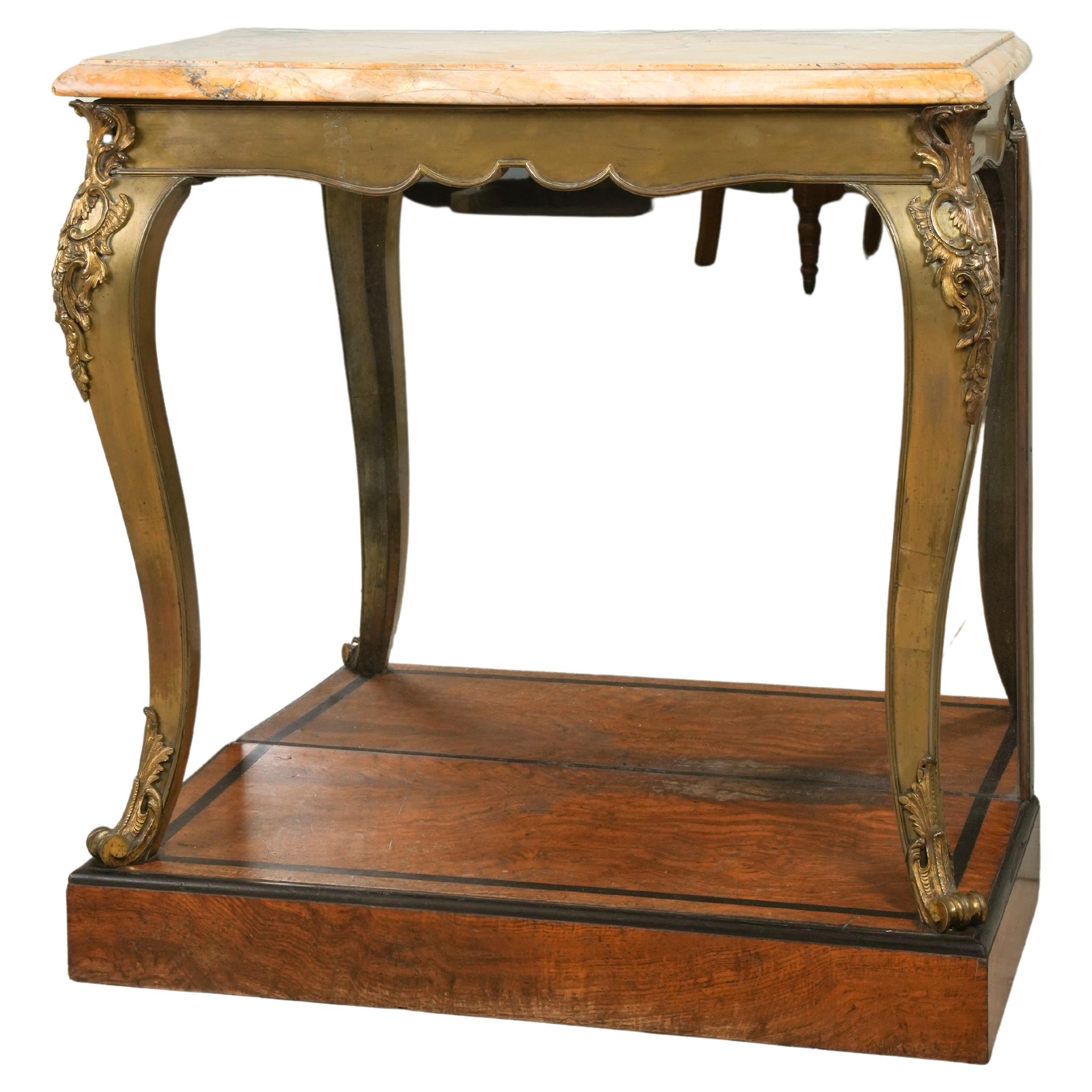 Raised on a burr elm and ebony plinth base with its original mirror plate, the bronze cabriole legs and shaped frieze below the original scagliola top, the whole in an untouched as found condition.