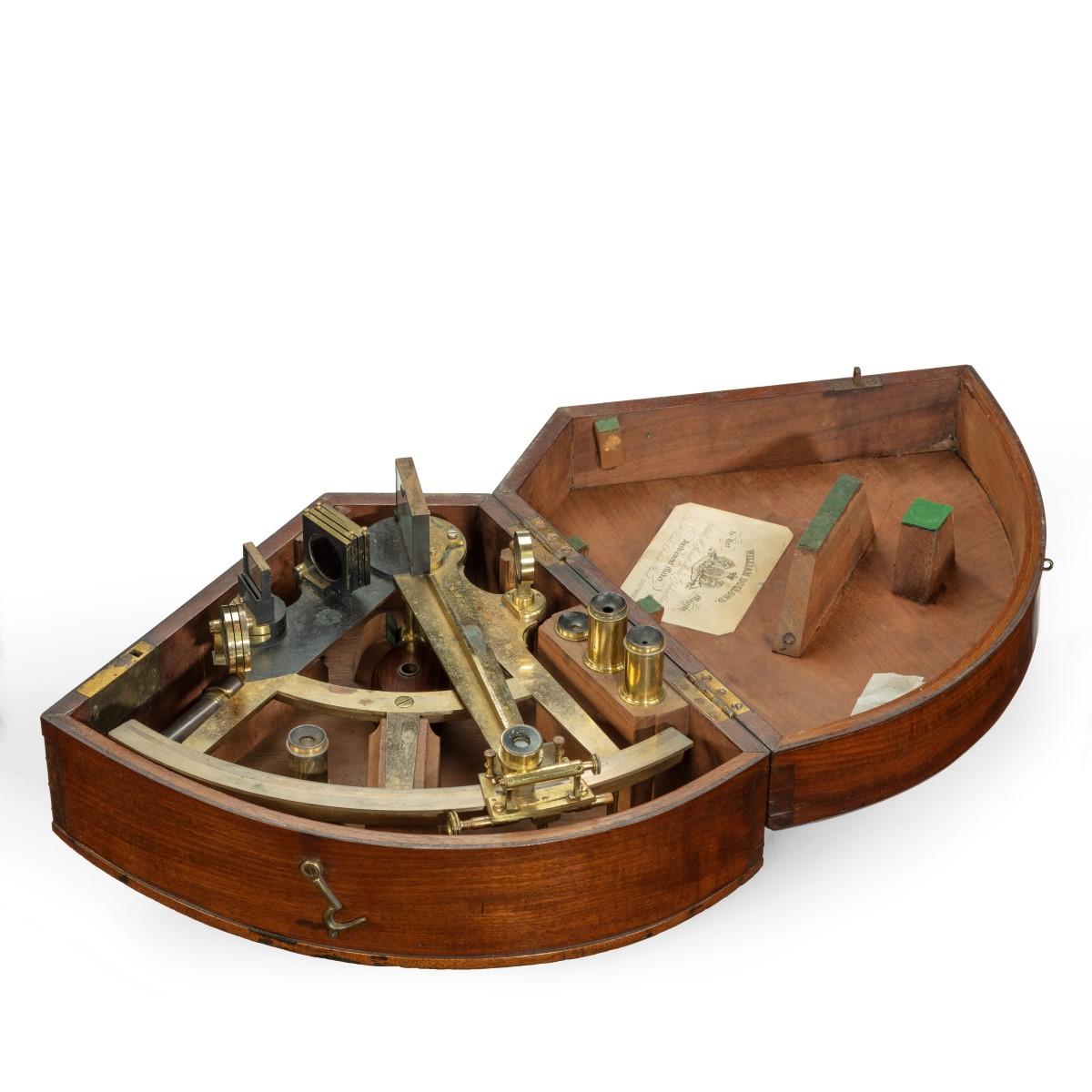 A brass Sextant by William Dolland, of typical form with a mahogany handle and selection of eye-pieces and lenses, in a fitted wooden case with a paper maker’s label stating ‘William Dolland, to Her Majesty, Optical, Mathematical, Philosophical