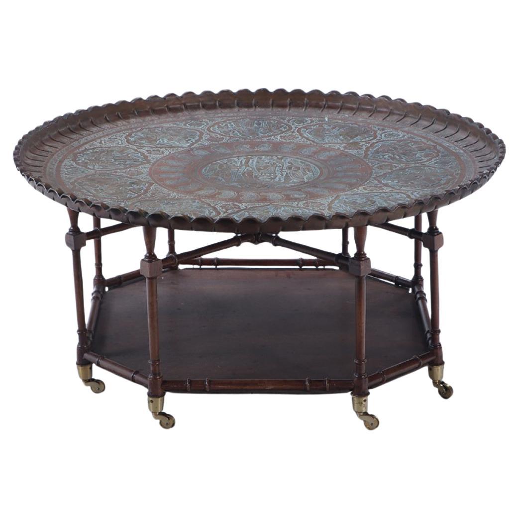 A brass tray top coffee table with a faux bamboo wood base circa 1960.  For Sale