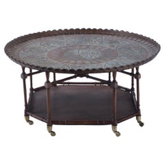 A brass tray top coffee table with a faux bamboo wood base circa 1960. 