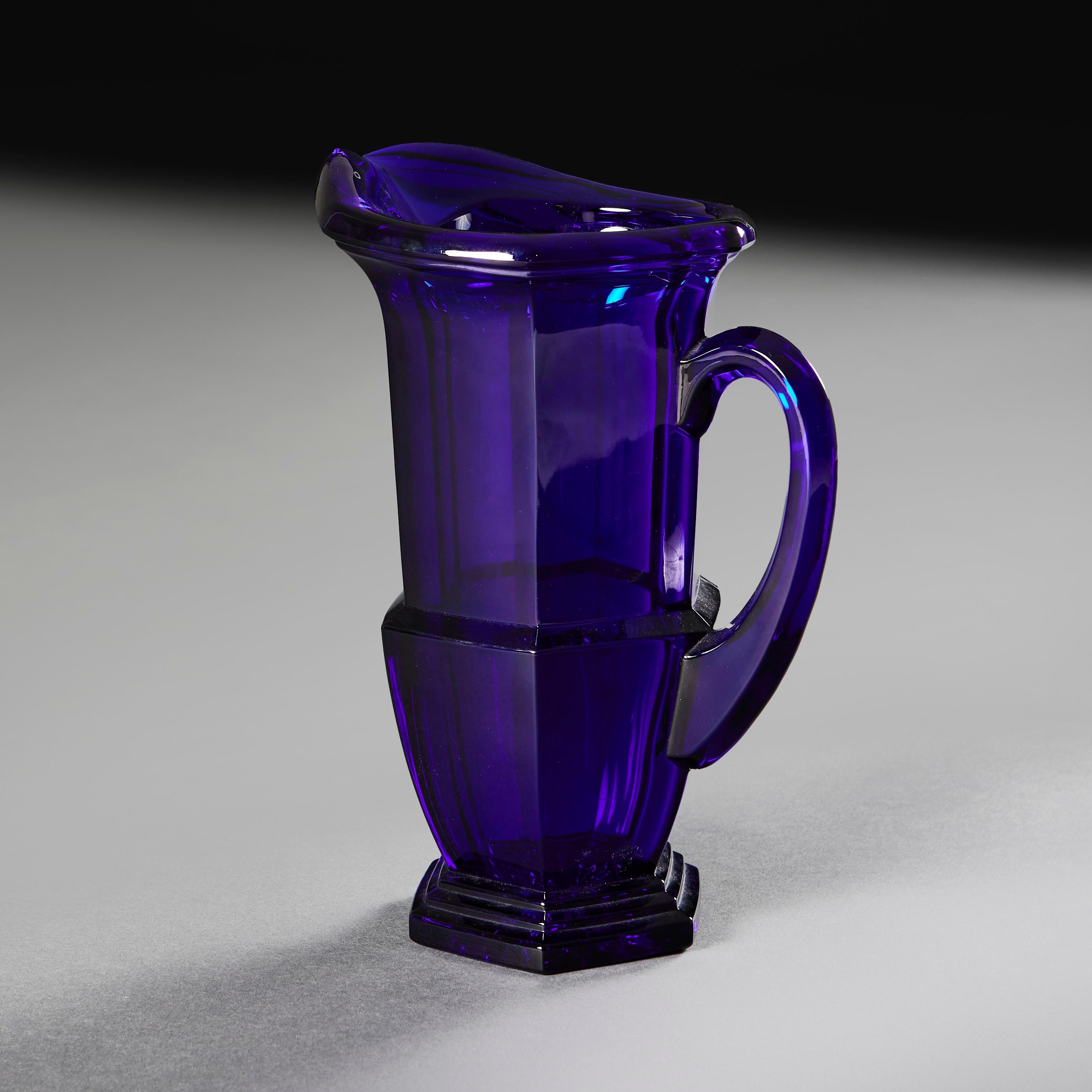 England, circa 1910

A striking early twentieth century Bristol Blue glass water jug, with loop handle and hexagonal stepped base.

Height    28.00cm
Width     21.00cm
Depth    15.00cm
Width of base   11.50cm