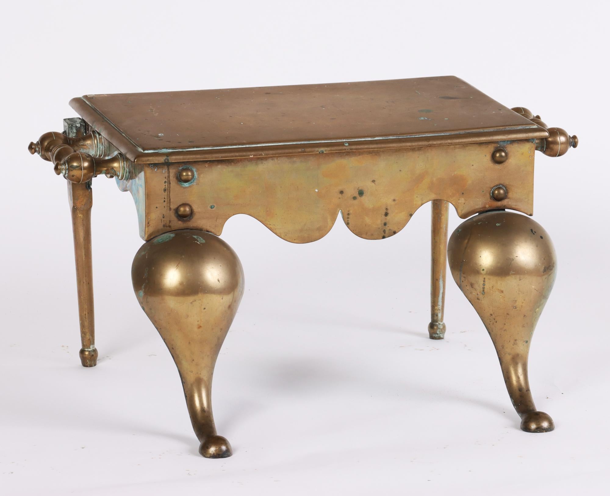 A British antique brass footman fireplace stool, nineteenth century. Brass handles and hardware used for warming tea kettles or irons near fire.