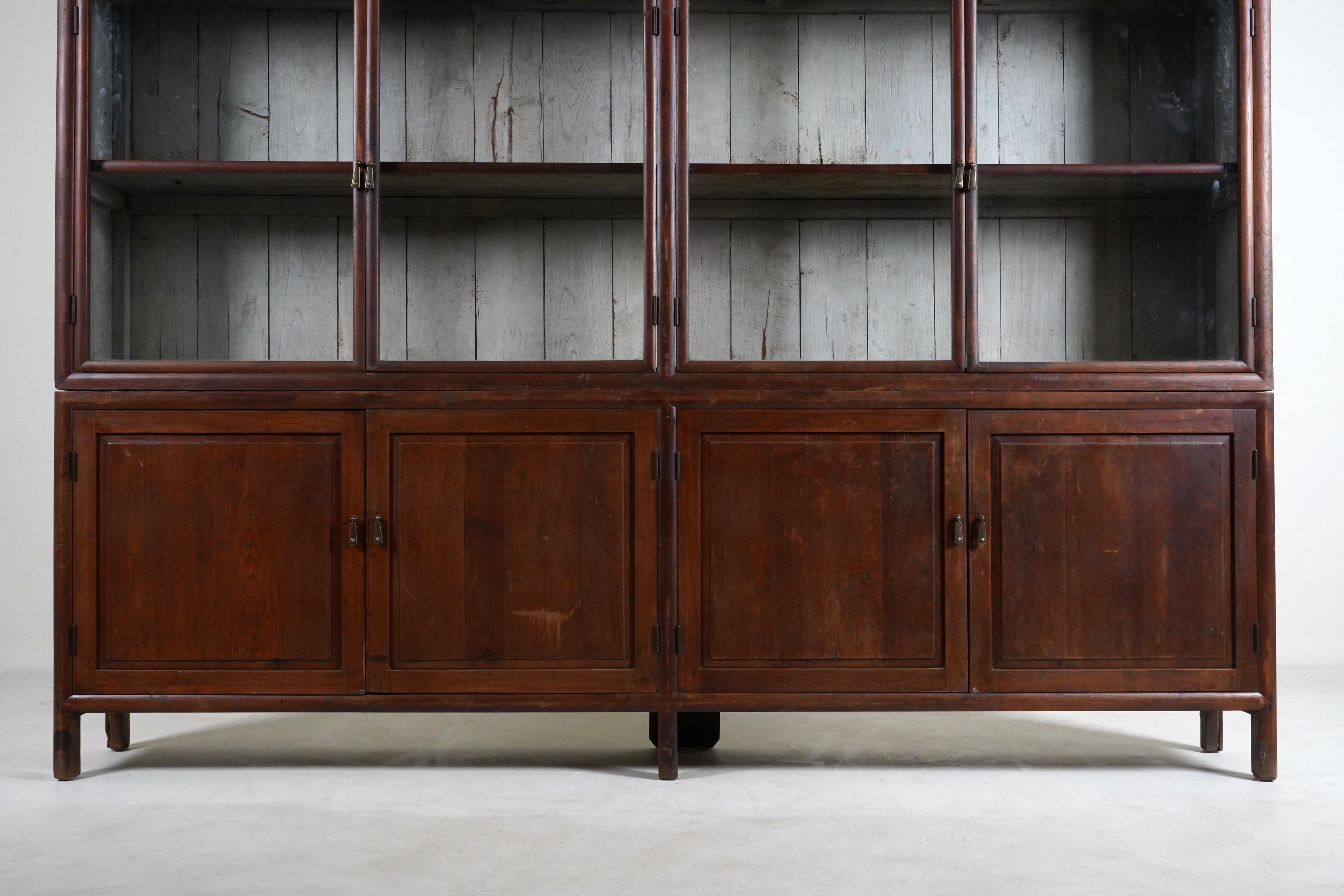 A British Colonial Art Deco Teak Bookcase with Lower Storage  For Sale 1