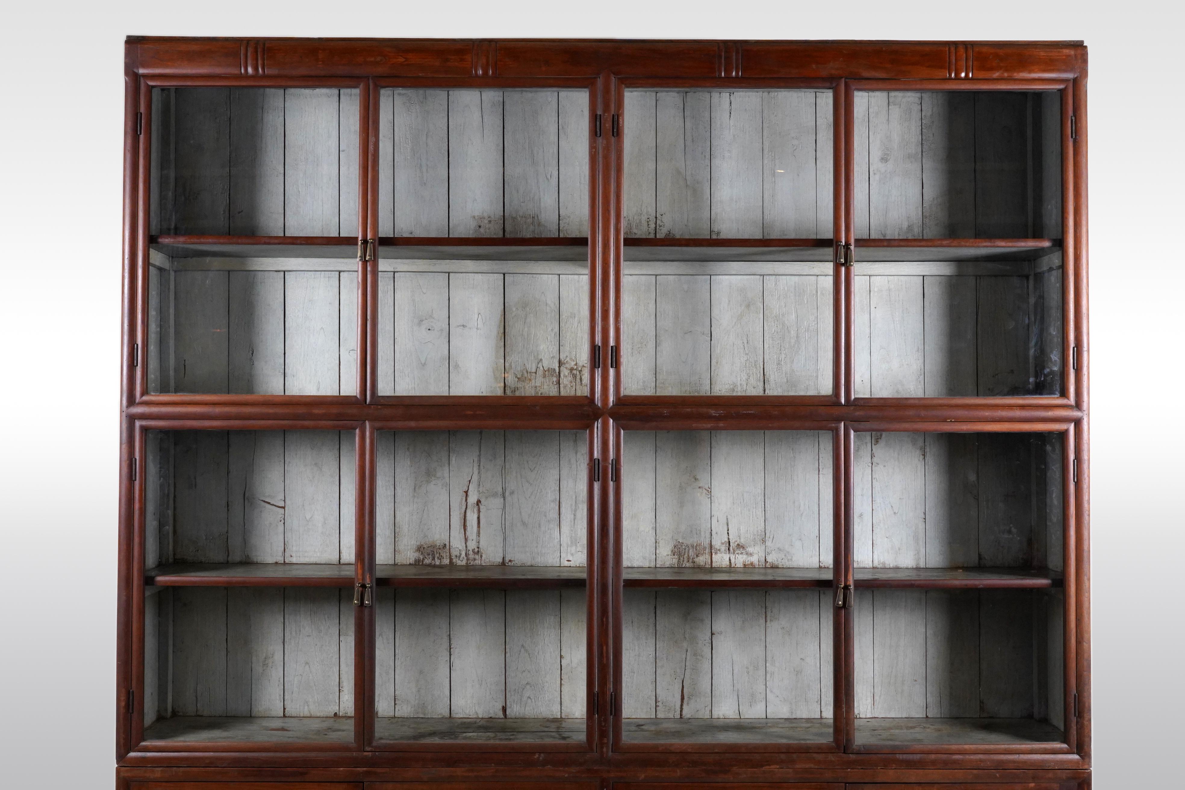A British Colonial Art Deco Teak Bookcase with Lower Storage  For Sale 3