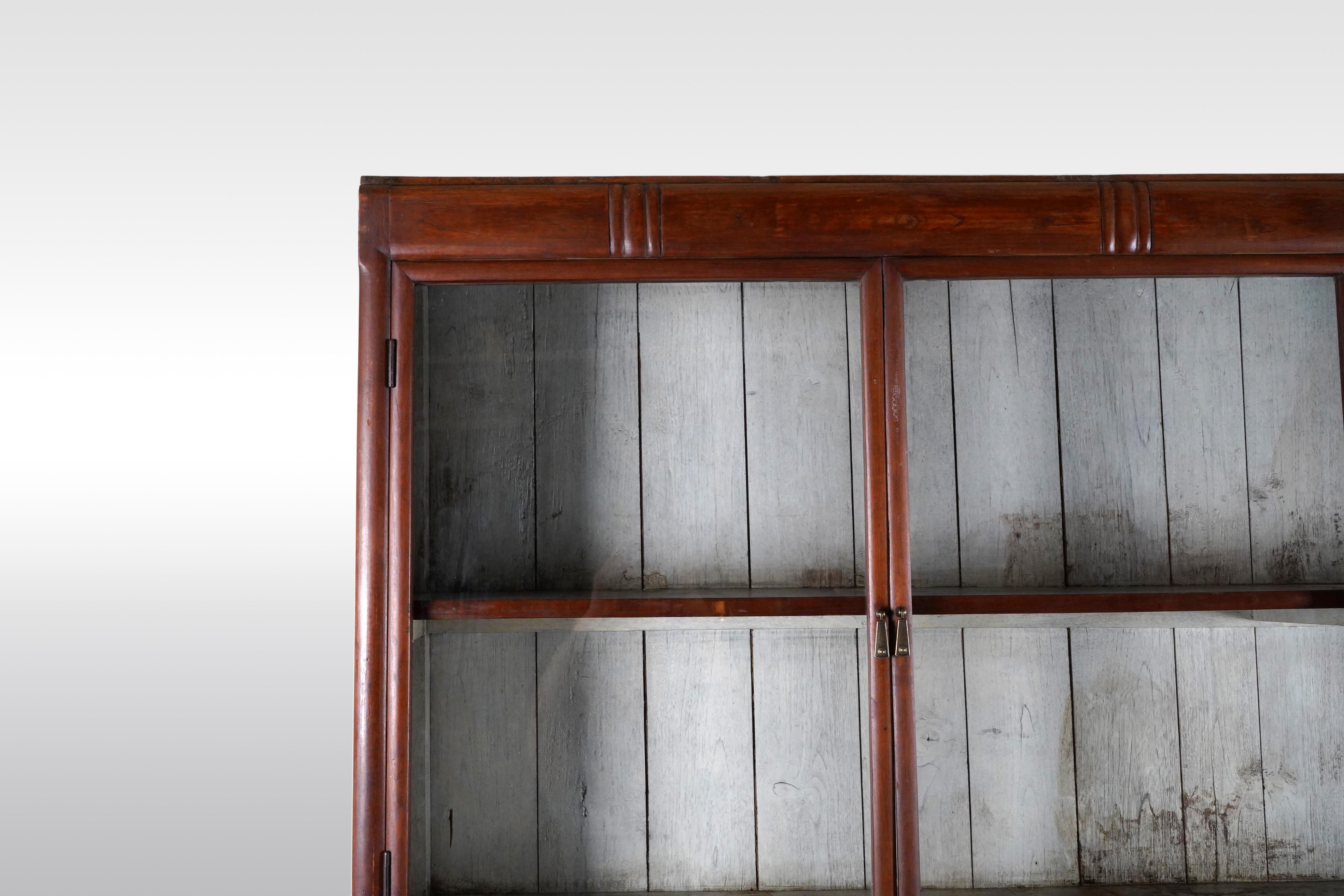 Glass A British Colonial Art Deco Teak Bookcase with Lower Storage  For Sale
